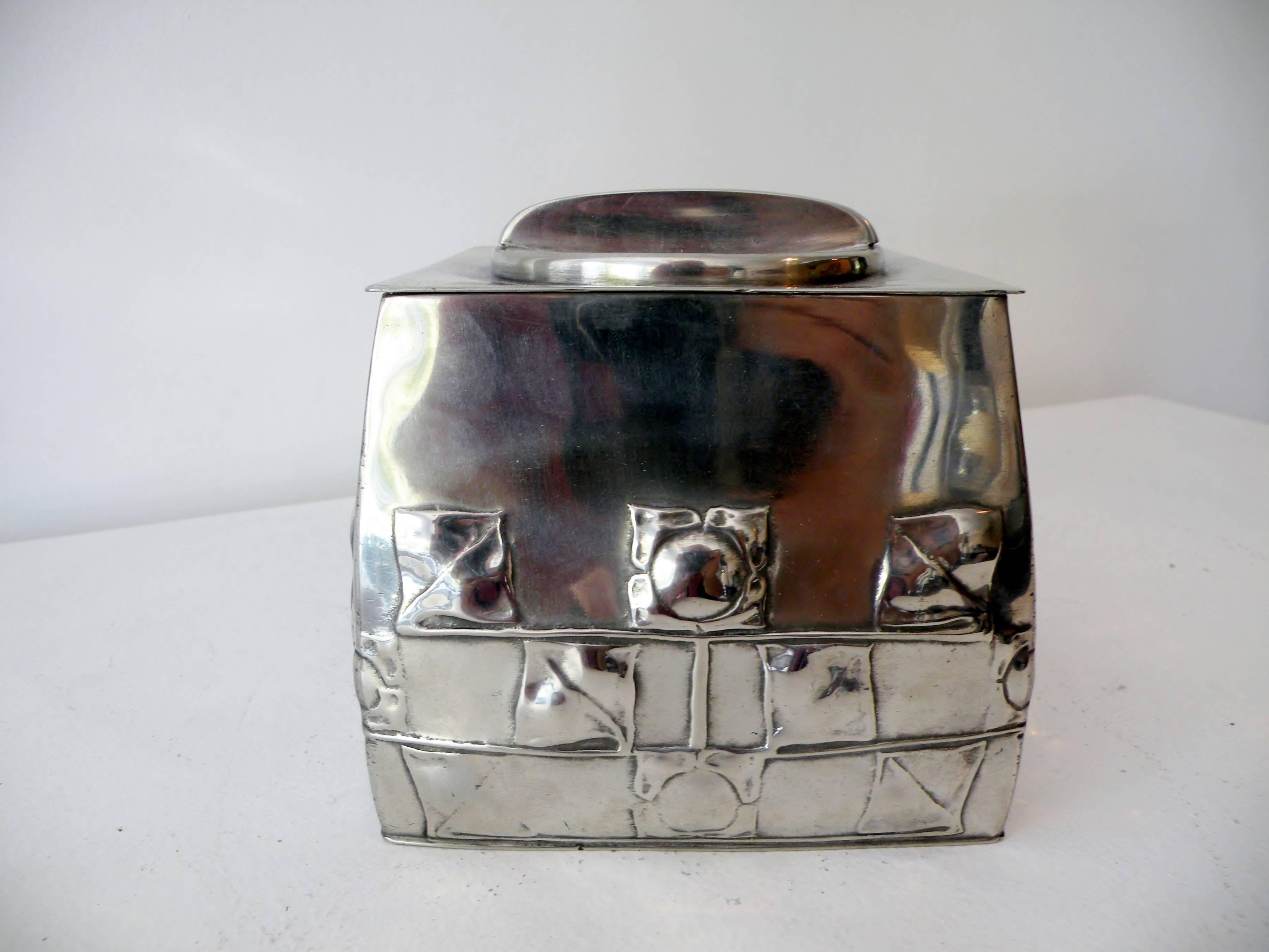 Early 20th century Archibald Knox Tudric pattern biscuit box, model number 0194. Designed for London's Liberty & Co., crafted of pewter, and marked to base. Measures 5.5
