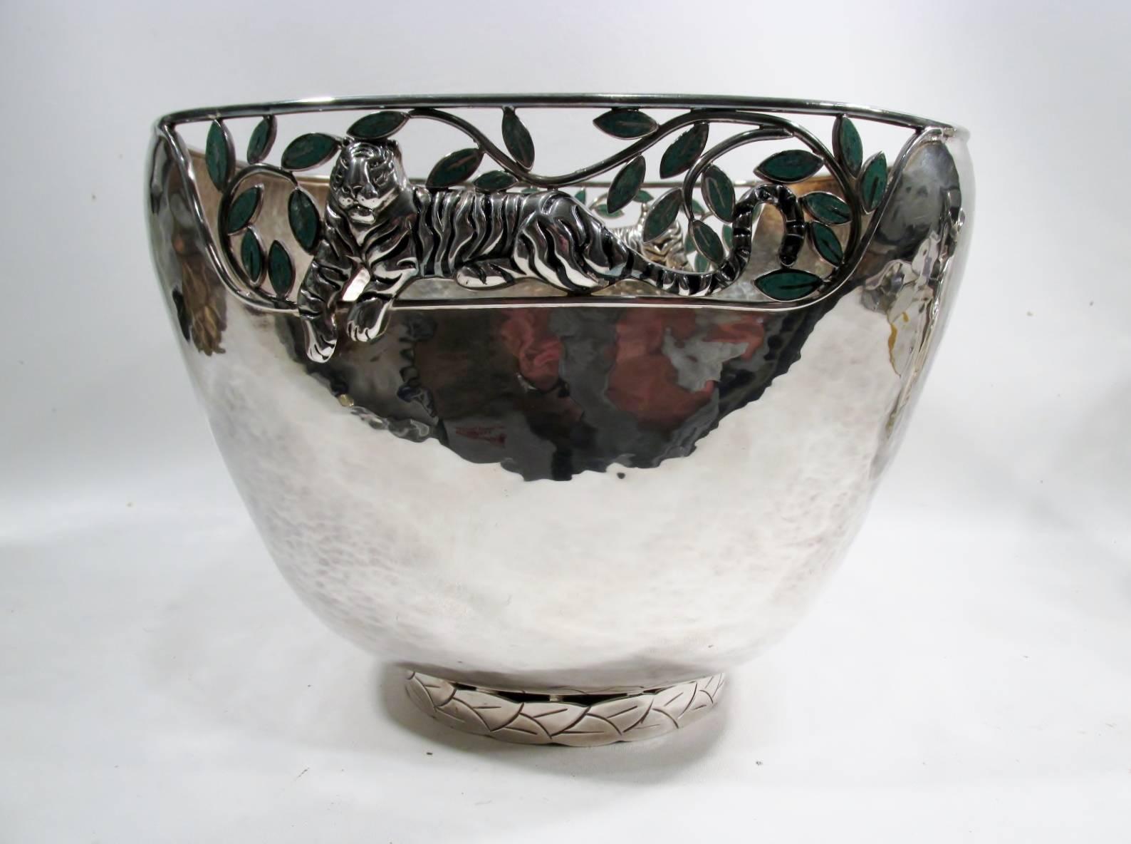 Large centerpiece or serving bowl from the renowned Taxco Mexico workshop of Emilia Castillo. Heavy silver plate on copper with reticulated rim including her iconic tiger motif and malachite inlay leaves and hand-hammered surface finish.

Emilia