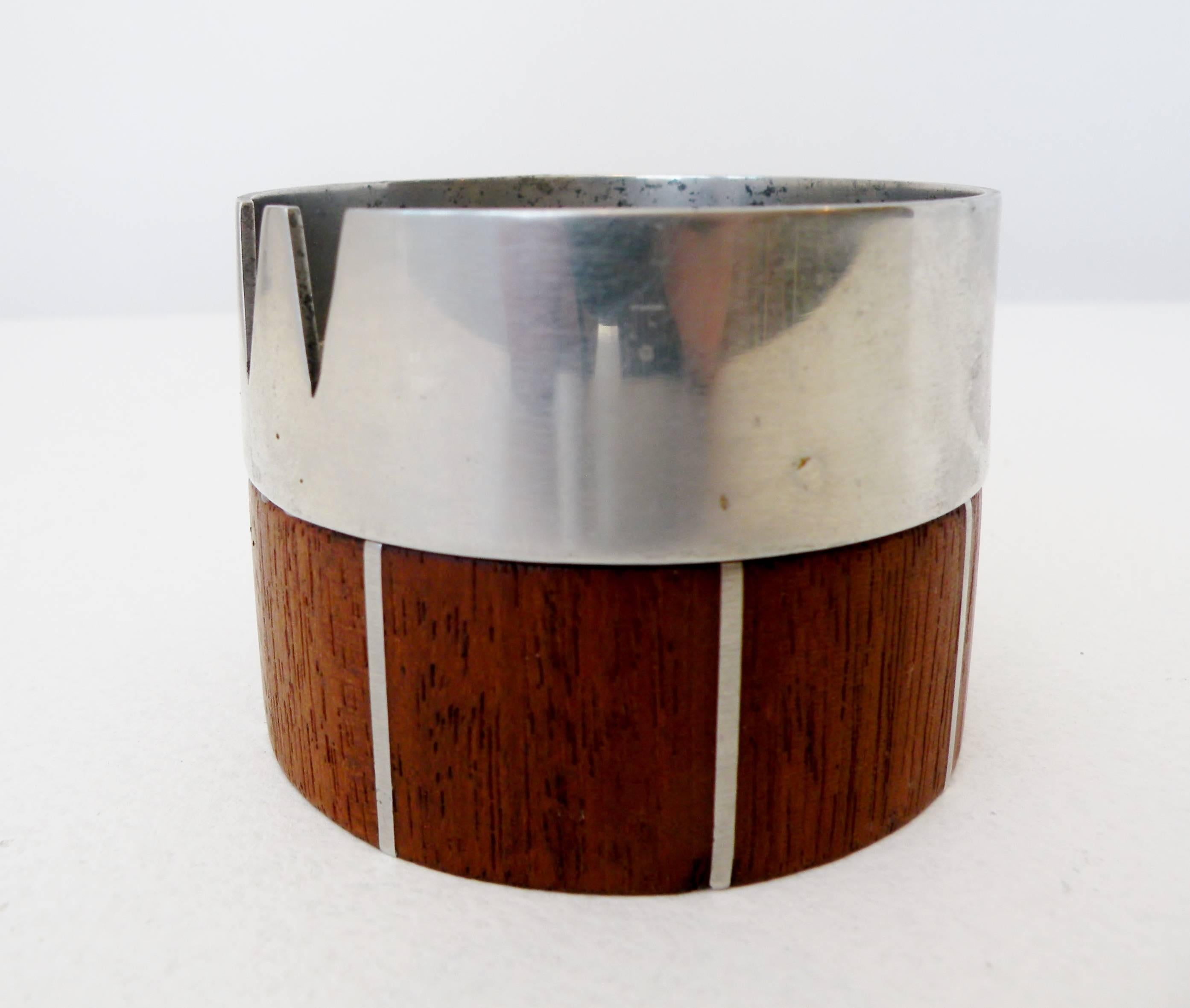 A late 1950s stainless steel and walnut ash receiver designed by Phillip Llyod Powell and Paul Evans for their in house workshop.