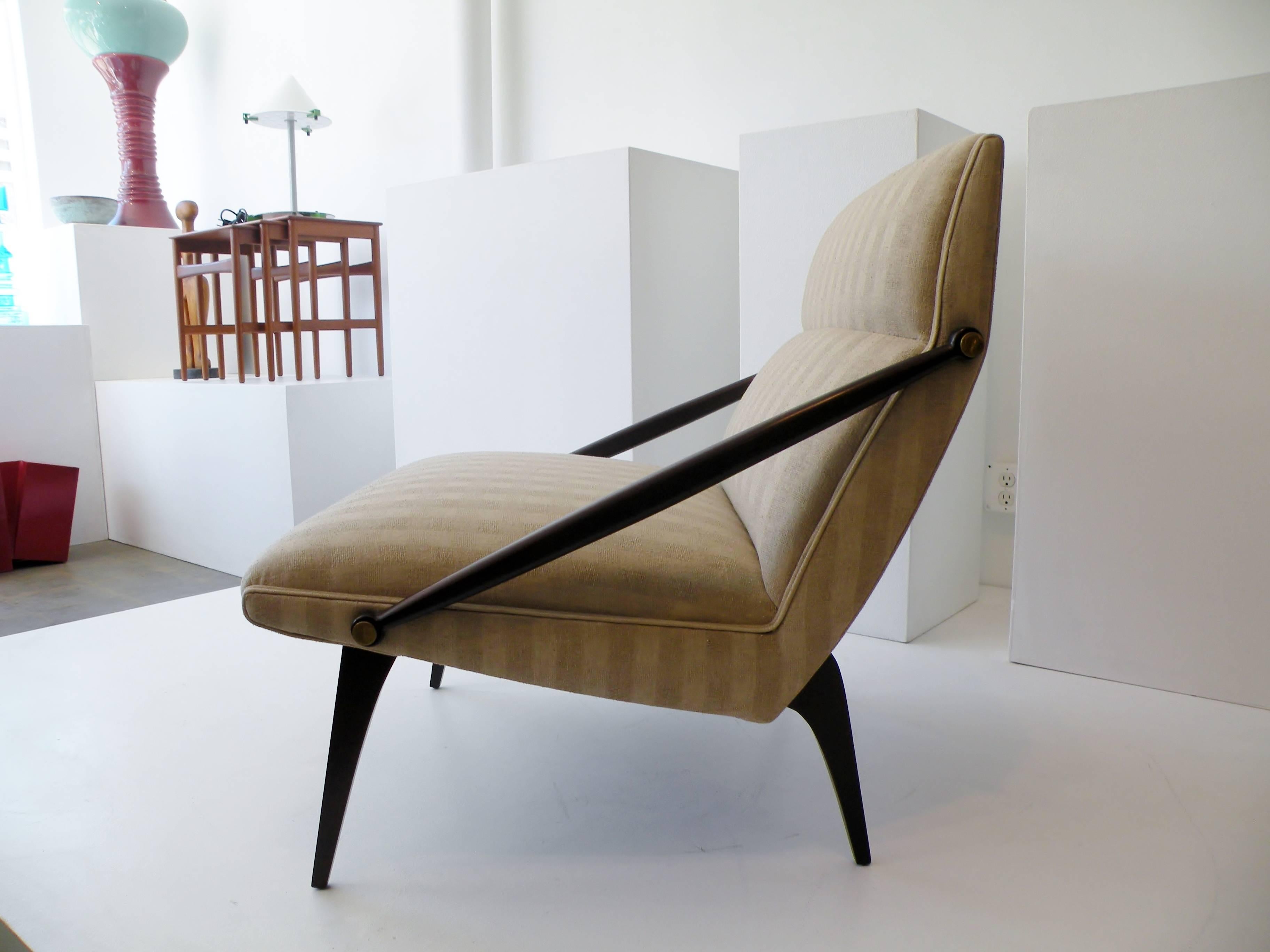 An elegant and rare Italian lounge chair. Sculptural cantilevered form often attributed as a design by architect Gio Ponti. This lounge chair manufactured by M. Singer and Sons, restored and newly reupholstered with backed silk.