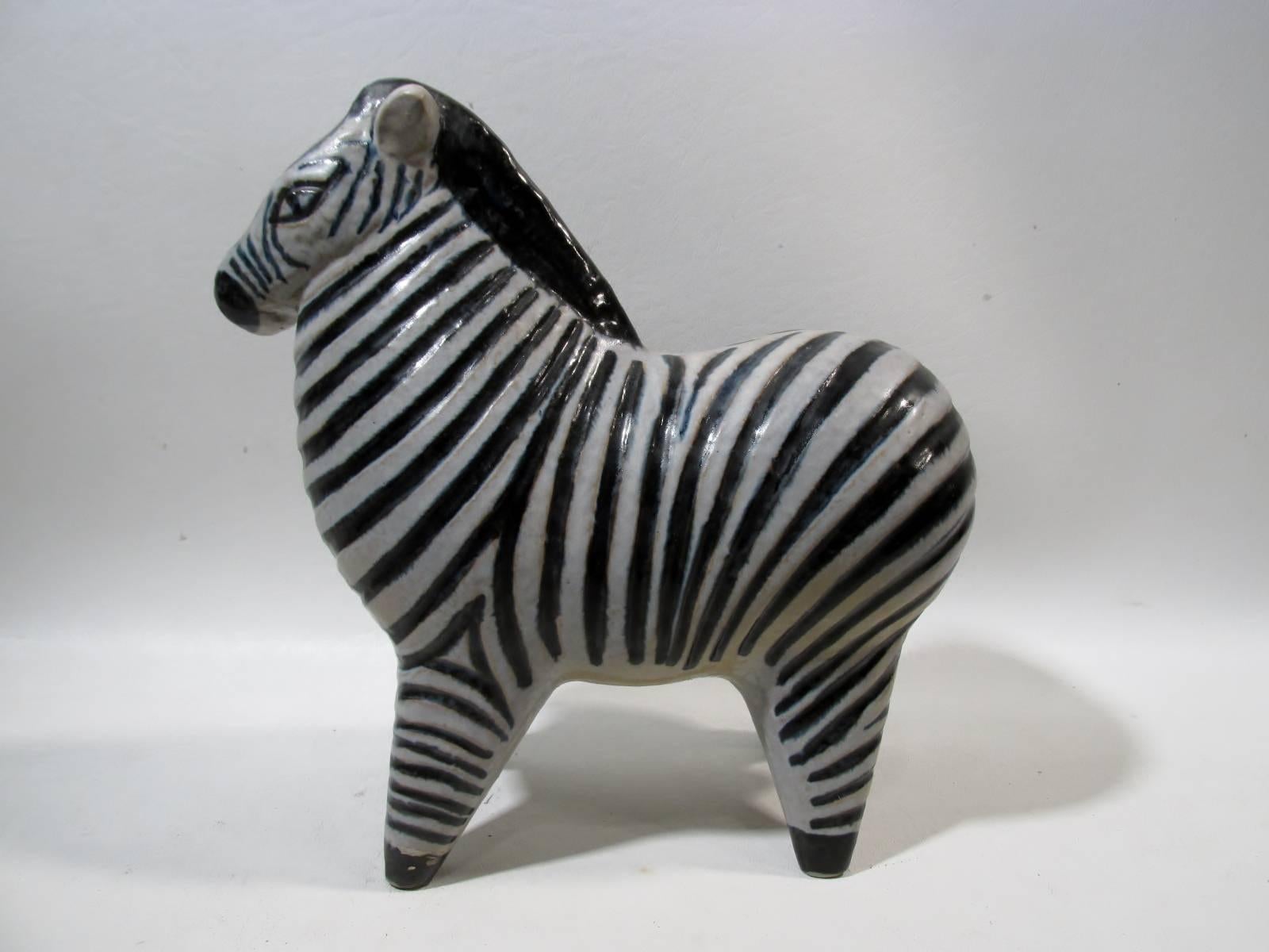 Modernist art pottery large “Stora Zoo” zebra figure designed by Lisa Larson for Gustavsberg Sweden in 1957. Retains original paper label to underside. 

Approximately 9” tall and 9” long.