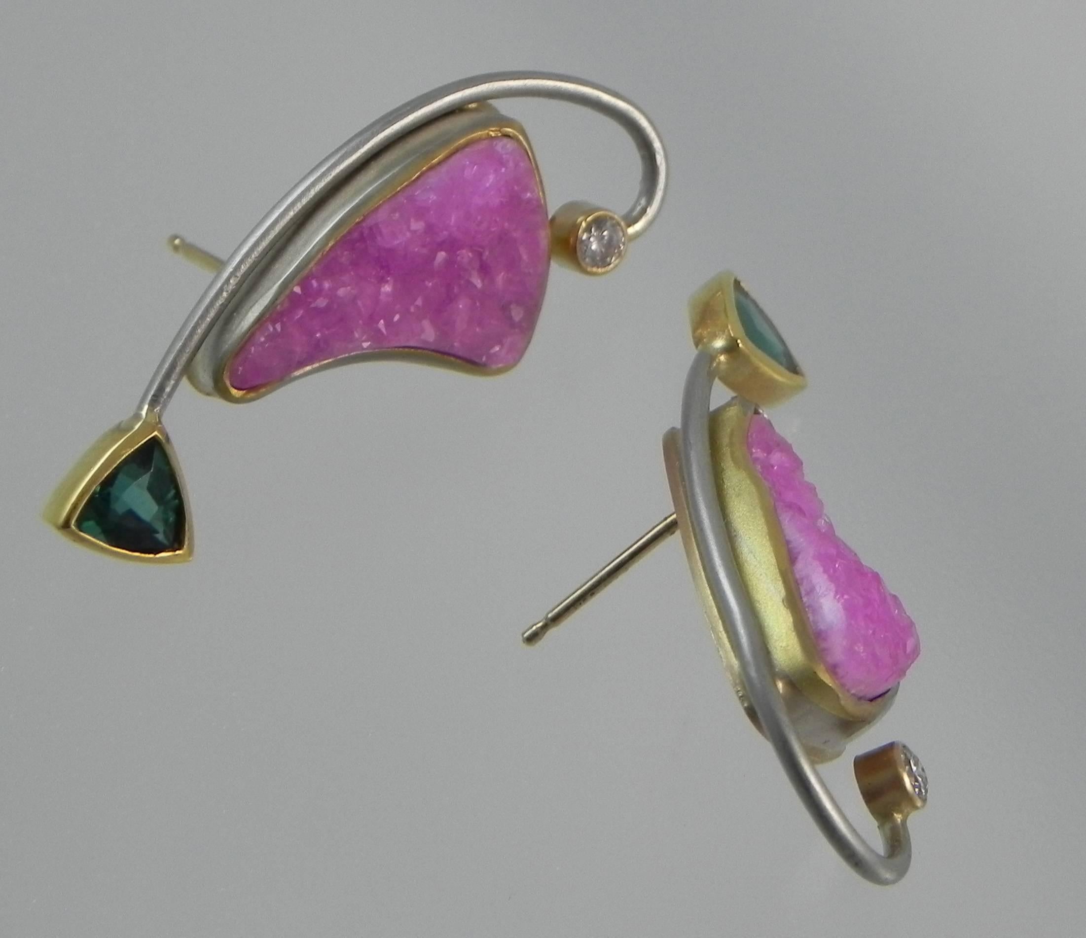 One of a kind and handmade earrings by Colorado’s Premier Jewelry Design Studio and Master Craftsman – Steven M. Parks.  The designer chose these stunning pink druzy calcite stones because of their unusual shape and amazingly intense pink color, he