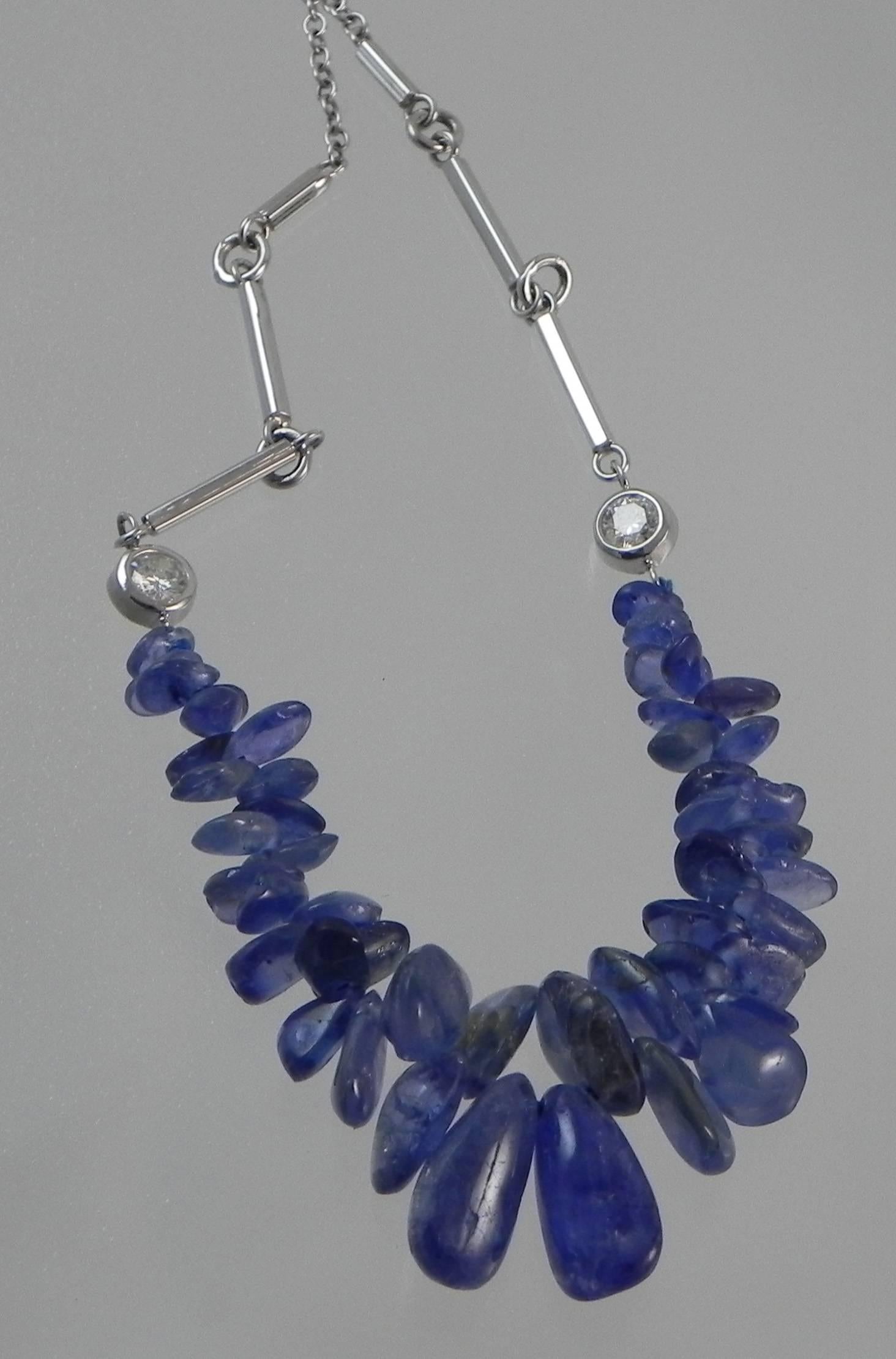 A 14Kt white gold handmade and one-of-a-kind neckpiece by Colorado’s Premier Jewelry Studio and Master Craftsman – Steven M. Parks.  These sapphire crystals were found in the formerly named “Ceylon” now Sri Lanka.  Naturally tumbled by the river,