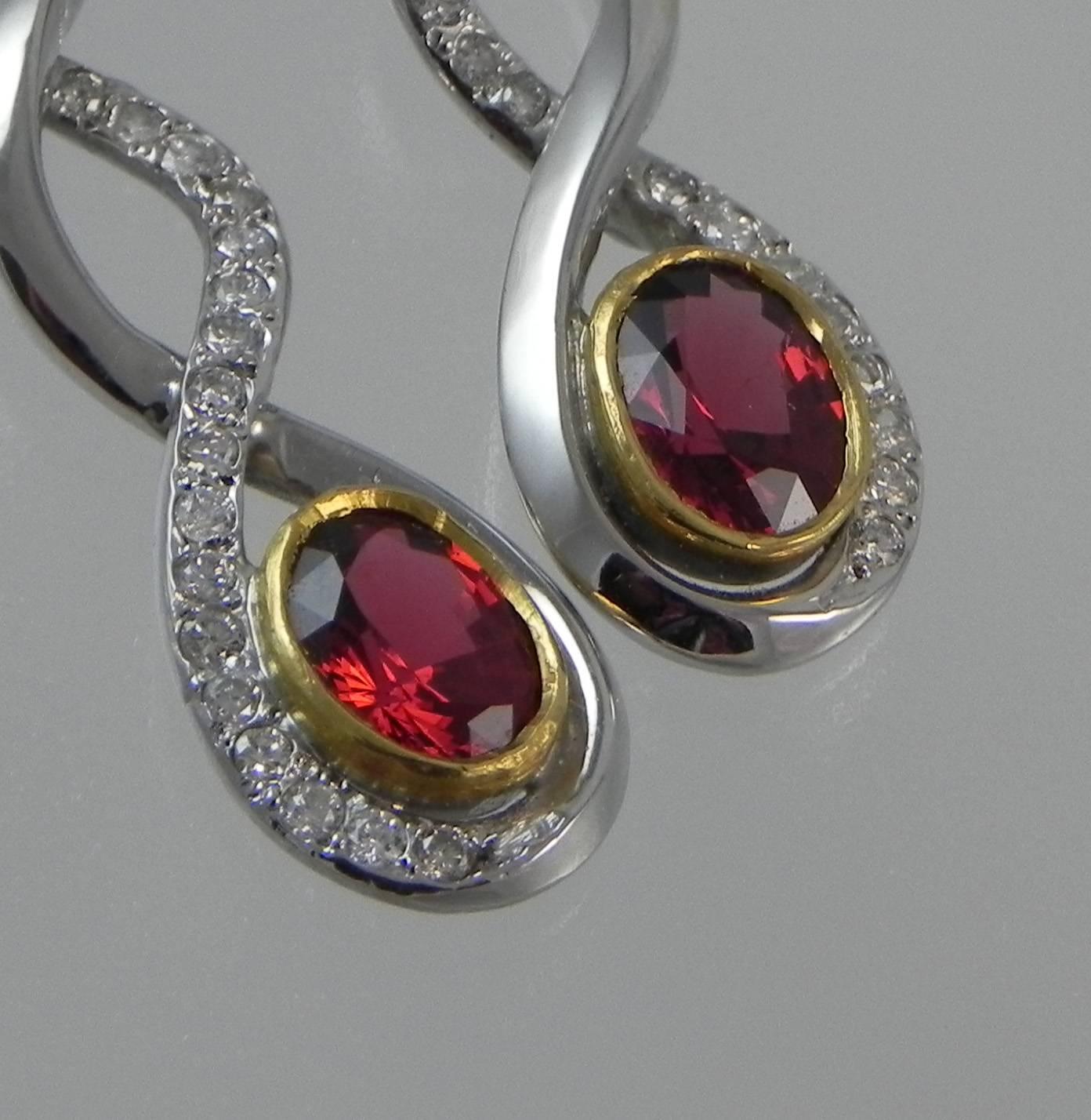 18KT White gold one of a kind earrings by Colorado’s Premier Jewelry Design Studio and Master Craftsman- Steven M. Parks.  Not only are the earrings a craftsman’s classic, but the Red Spinels he used to create them could only be one of Nature’s