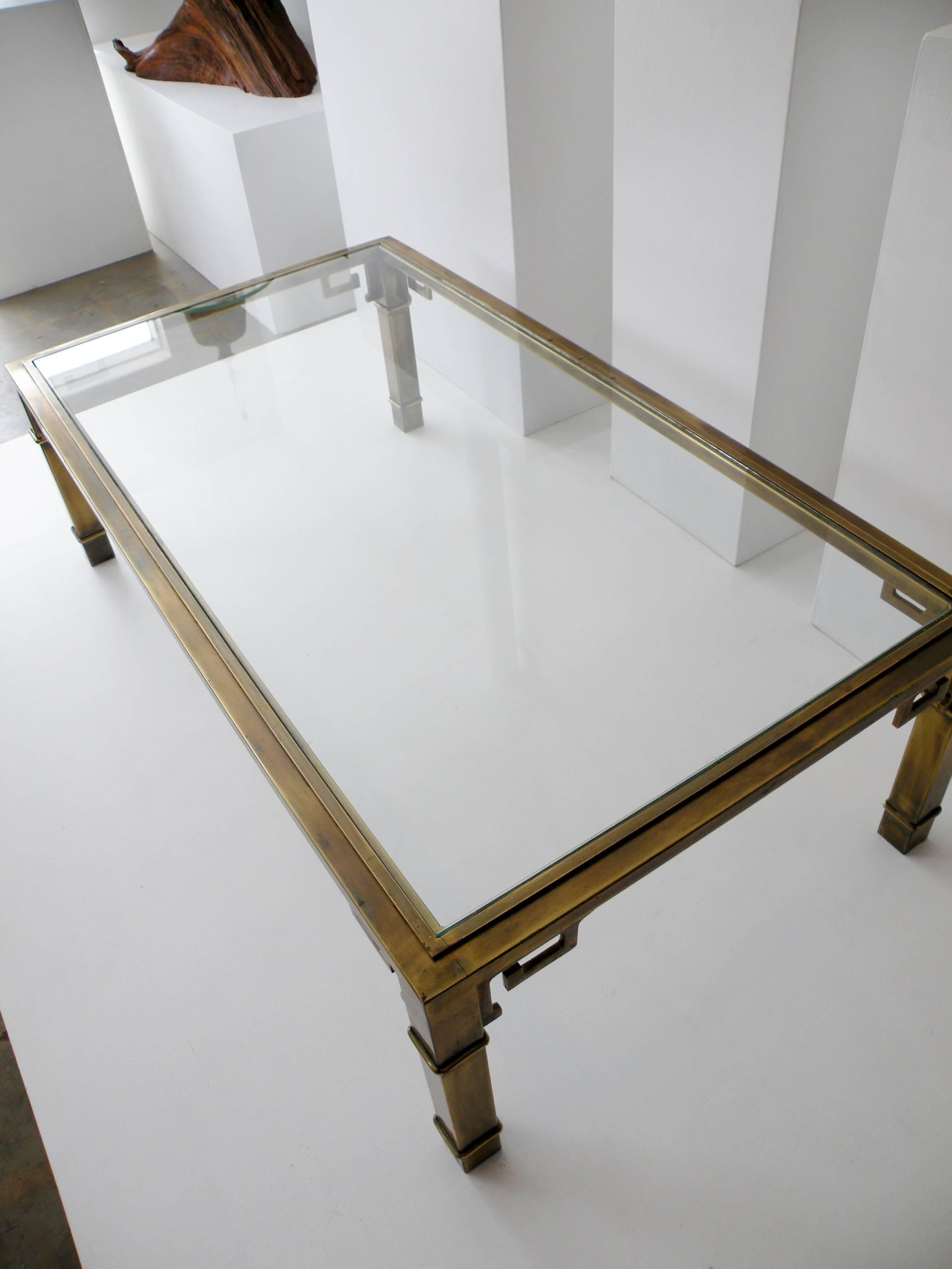 Iconic 1970s patinated brass rectangular coffee table with a Greek Key chinoiserie motif from the renowned luxury workshops of Mastercraft Furniture.