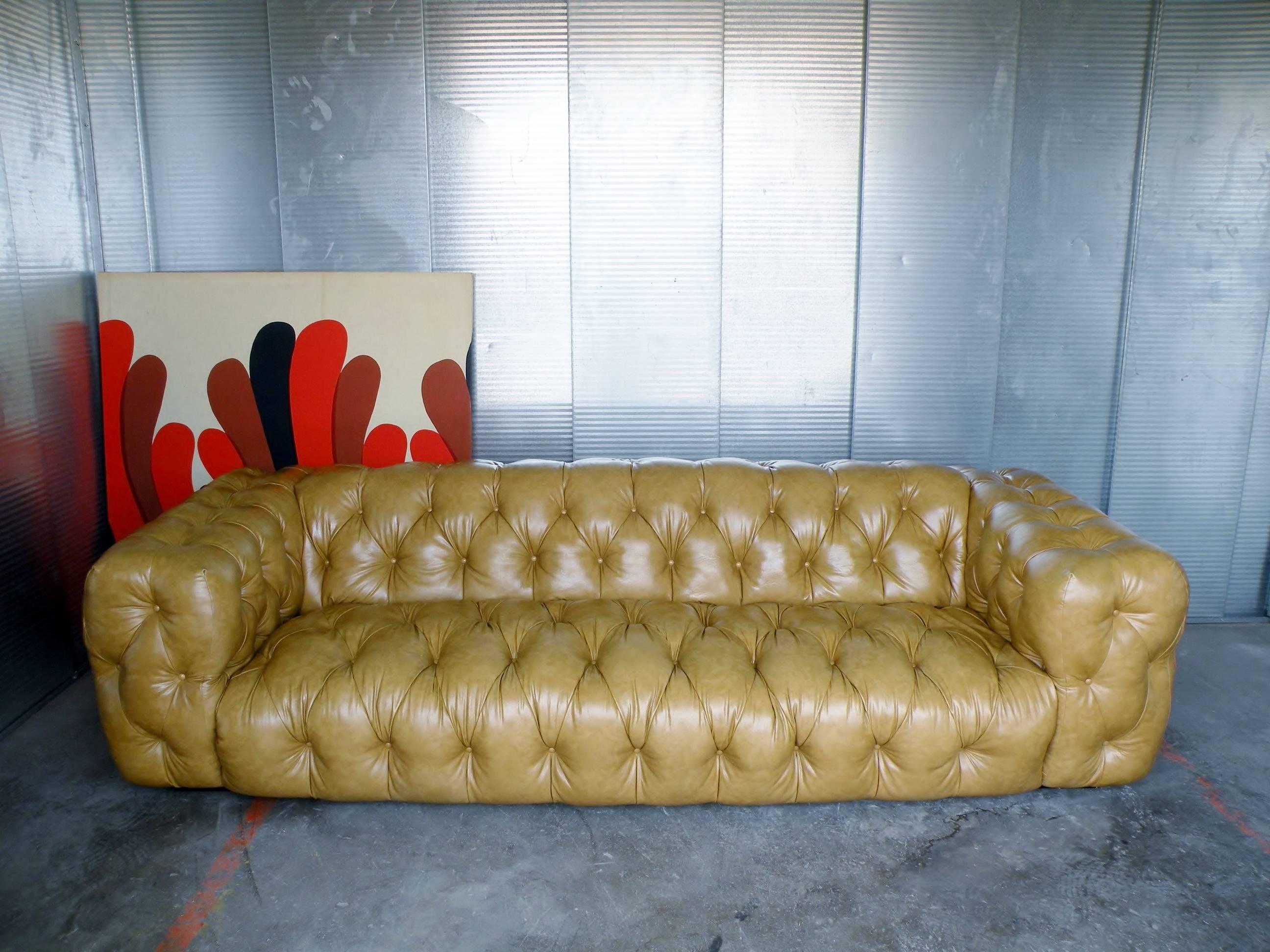 Important and rarely seen 1970s era Milo Baughman for Thayer Coggin tuxedo style button tufted sofa. Modern luxury meets the Classic Chesterfield sofa. Floats on low platform base with all sides and surfaces fully tufted in original soft man-made