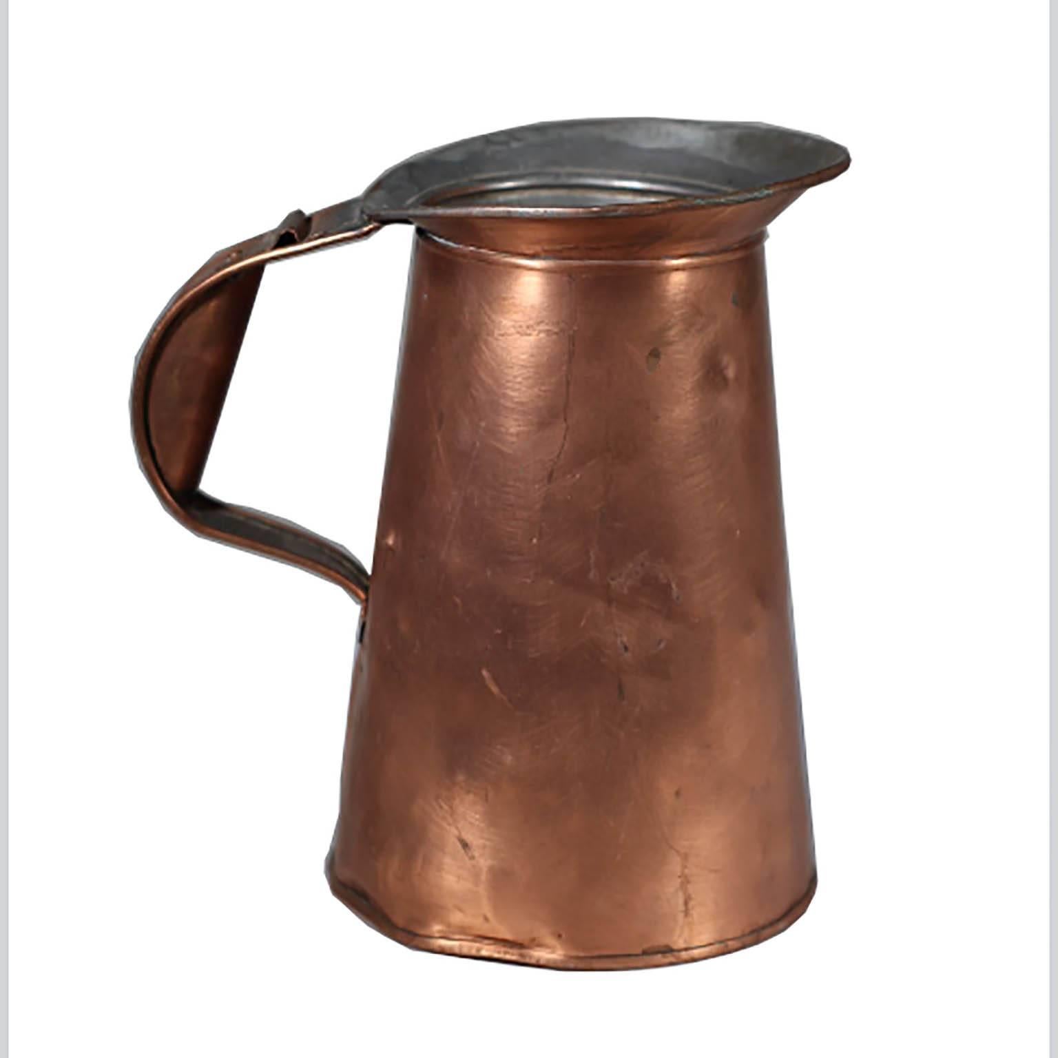 Vintage copper pitcher and copper tray. Pitcher is stamped 