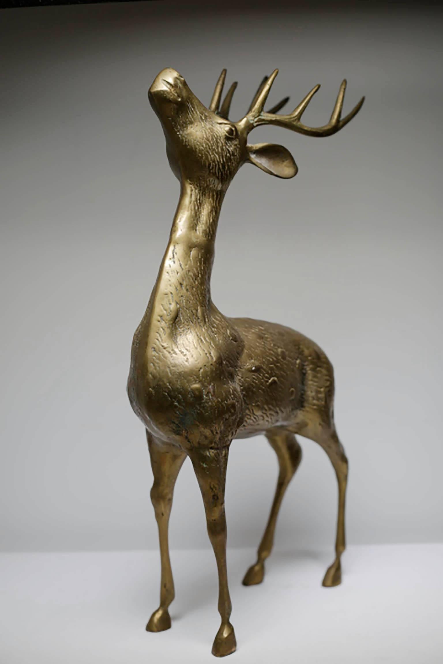 Mid-Century brass deer looking upwards.