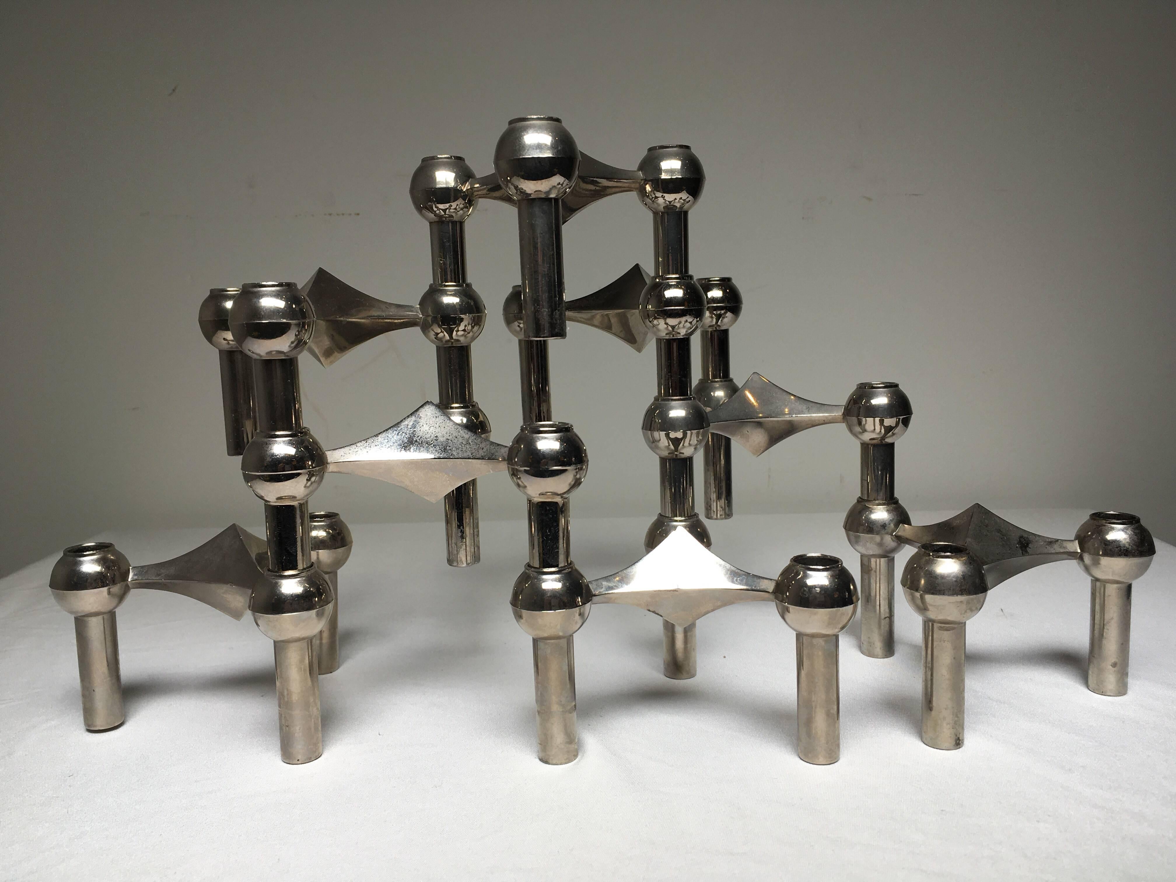A molecular/atomic looking sculpture made of eight individual candleholders. The system is designed by Caesar Stoffi and Fritz Nagel for BMF in Germany during the 1960s. This modular design can be configured in an endless number of ways both
