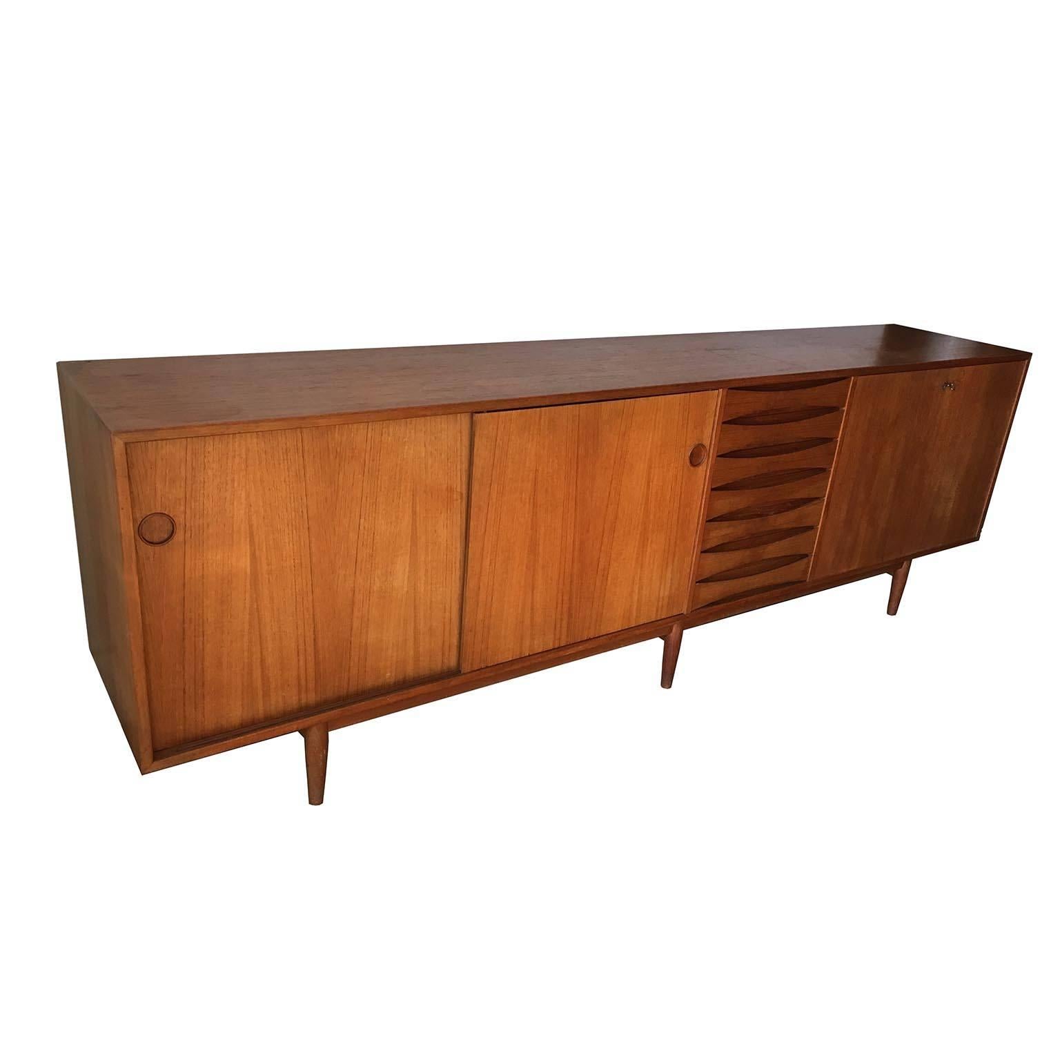 Credenza model 29A, in teak and wood, by Arne Vodder for P. Olsen Sibast MÃ¸bler, Denmark, 1959. Beautiful details can be found on this sideboard, for example, the characteristic drawers and the handles. Highly versatile item with plenty of storage