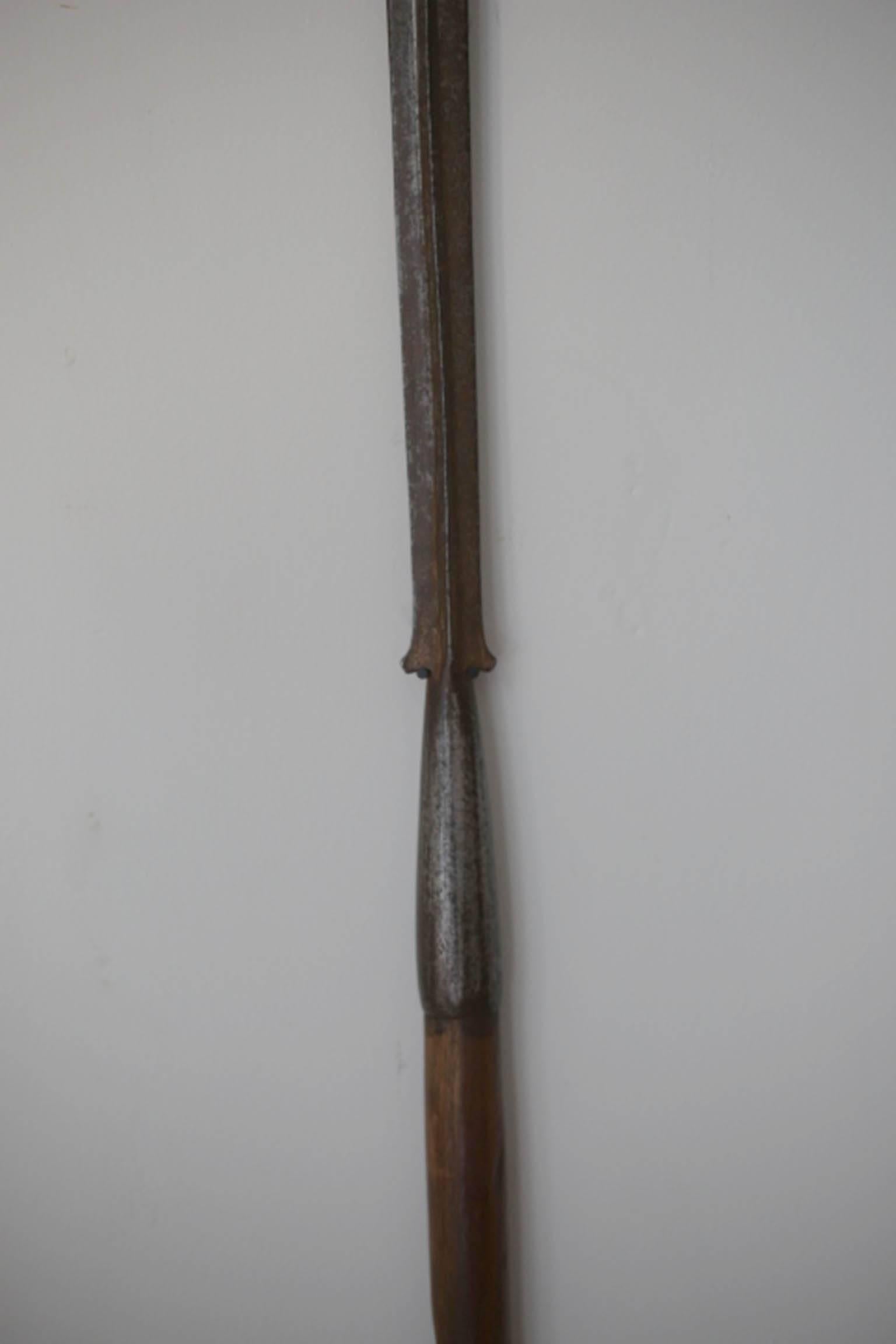 19th century lion hunting spear used by the Masaai people of Kenya, Africa. The spear is made of steel with beautiful antique wooden handle.