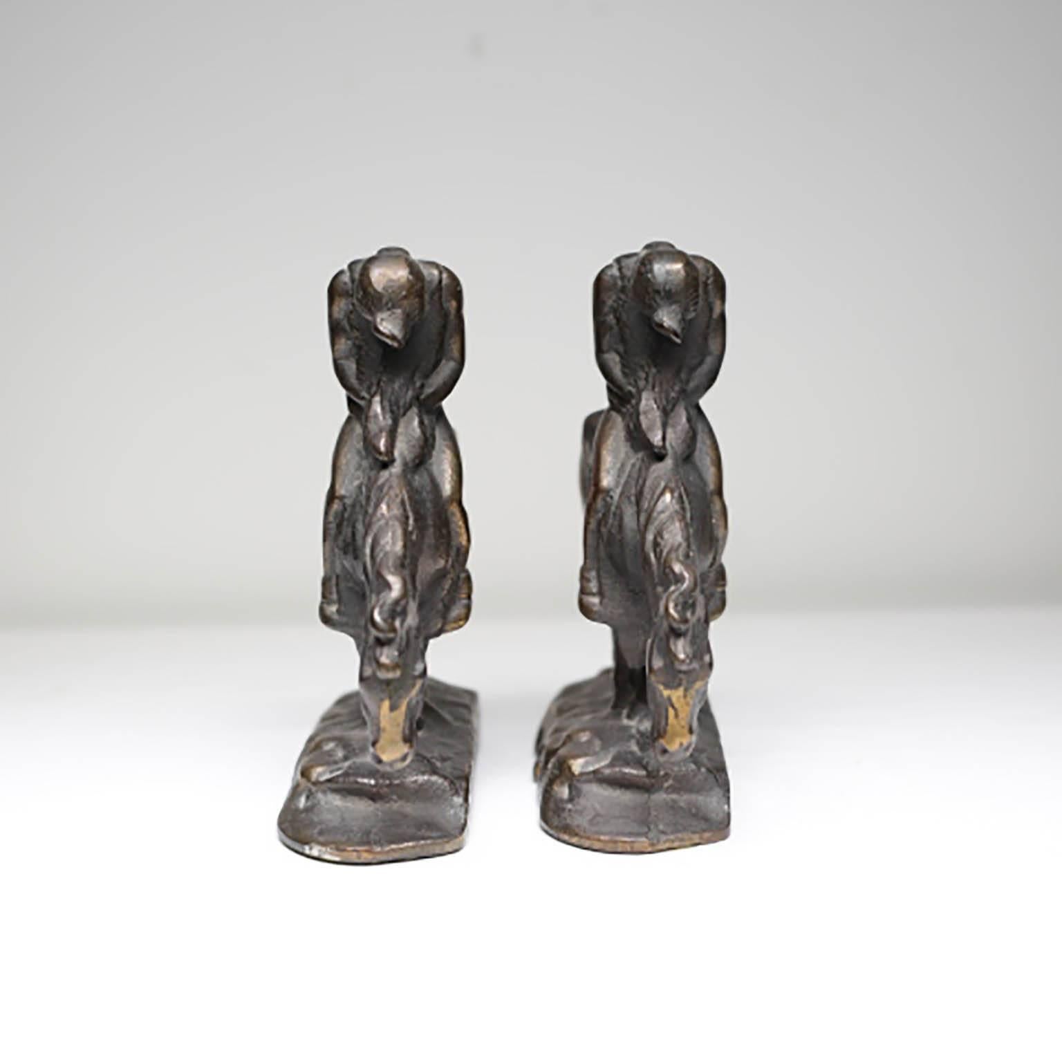 Pair of solid bronze bookends depicting a Native American on a horse.