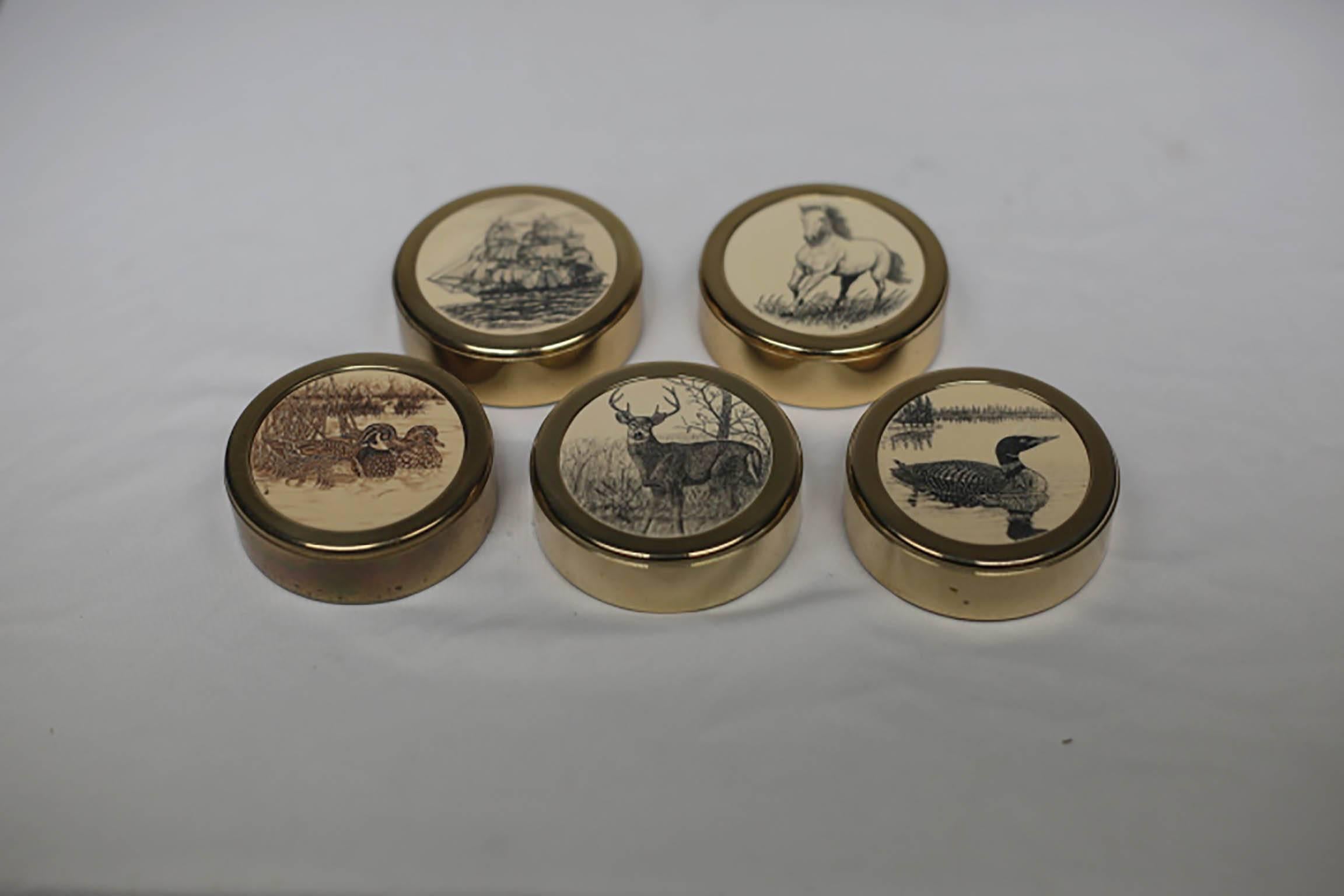 Collection of brass paperweight with fine detail carvings on an inset material possibly bone. 
Collection includes: 
Horse (Sold)
Ship
Loon (small indentation)
Ducks
Deer.