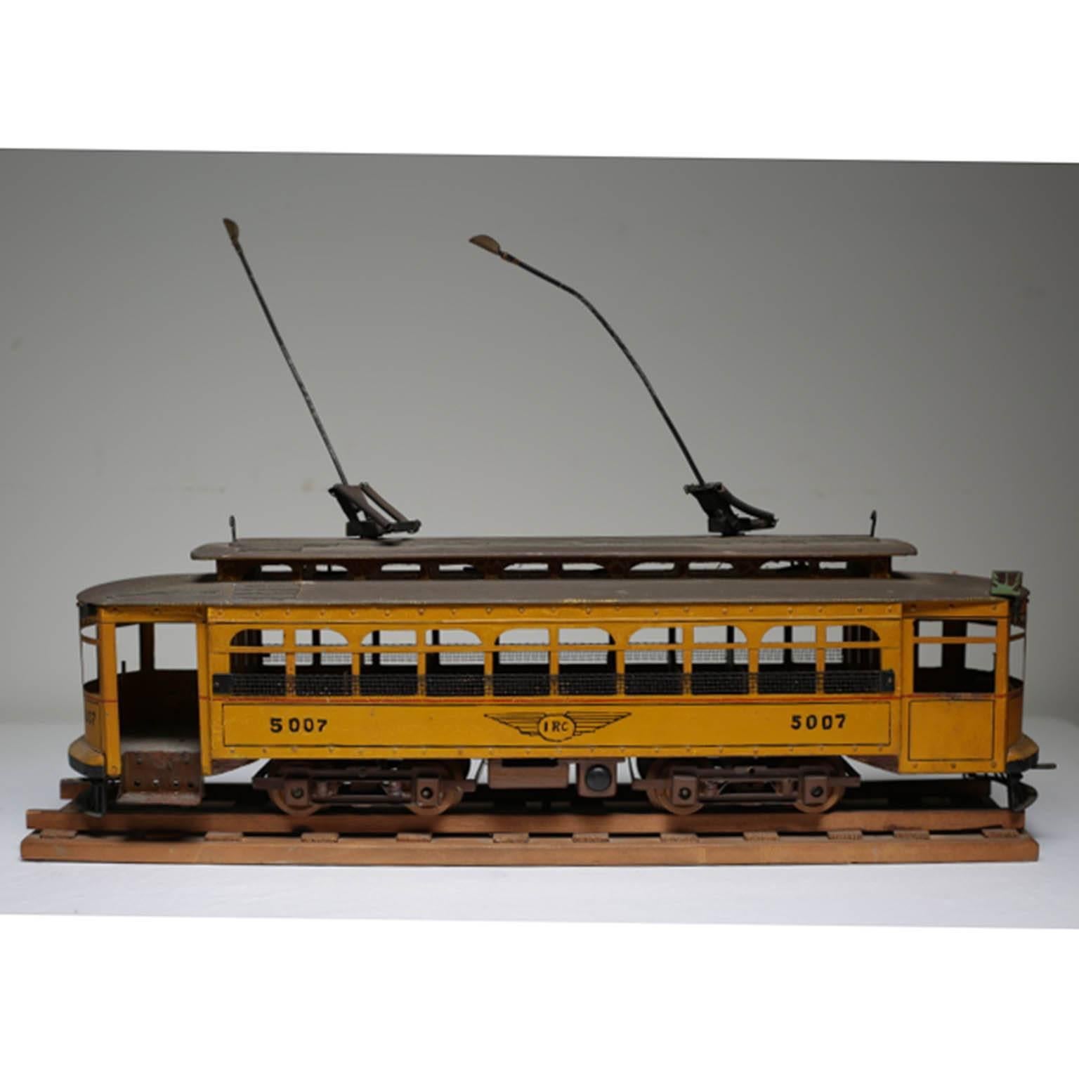 Handmade metal streetcar model mounted on wood. Highly detailed. Signed by artist.