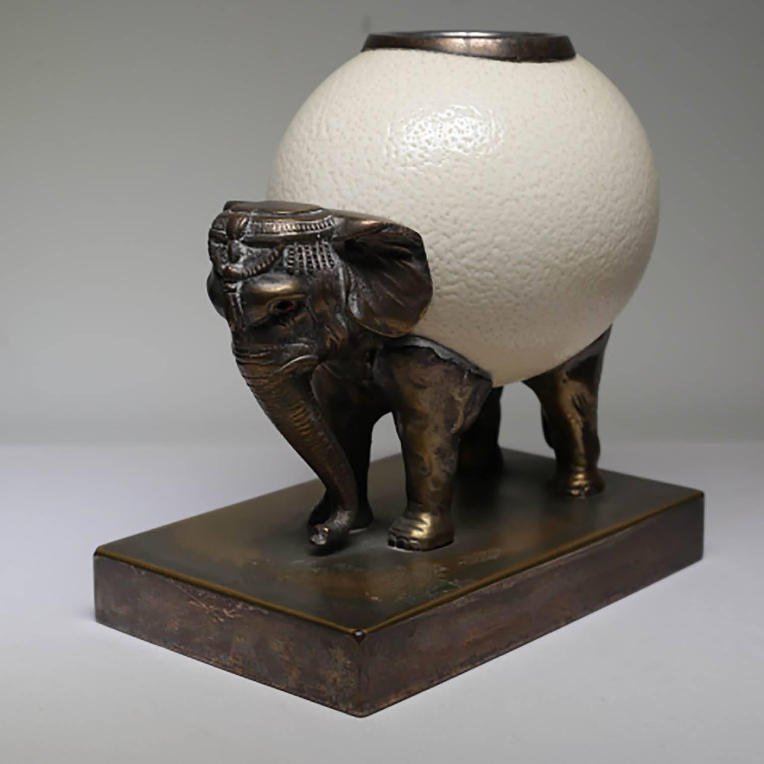 Bronze elephant and ostrich egg sculpture by Anthony Redmile, circa 1970s.
A candle, votive, or candy could be placed in the inner 