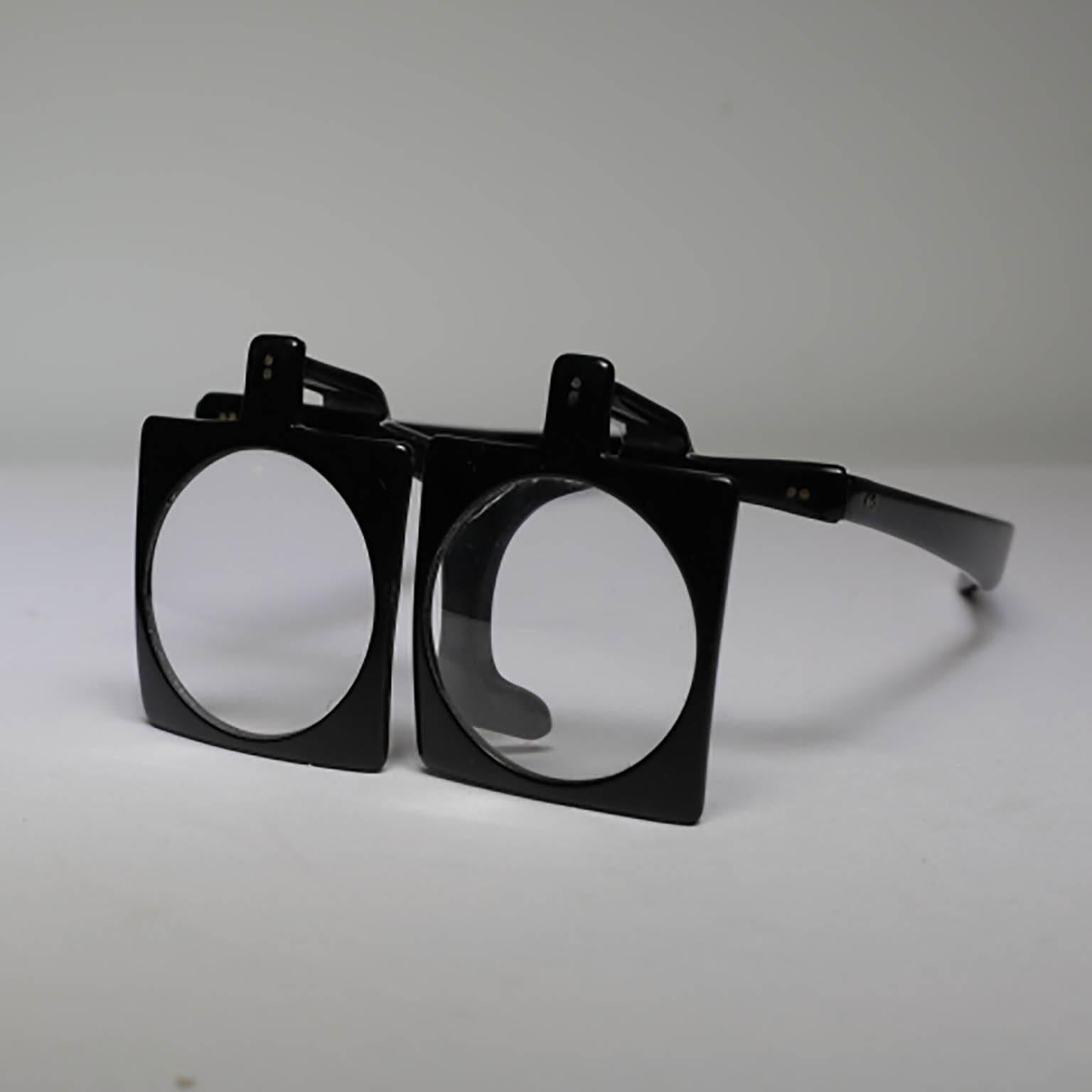 Pair of optometrist magnifying glasses. Each lens lifts up independently.
Amazing mounted on a steel stand for an unusual object on your coffee table or shelves.