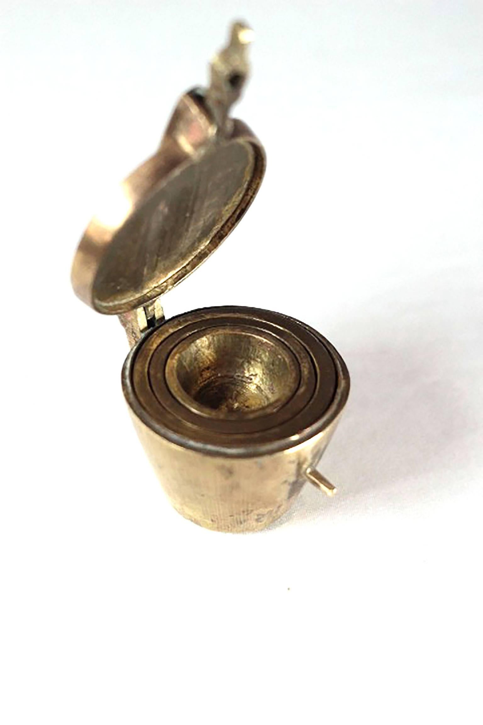 A nineteenth century apothecary's set of five cup nesting weights. (Smallest weight not pictured) The weights are contained in the largest weight which has a brass lid.

It appears that the total weight of all 5 weights together is about 489 grams