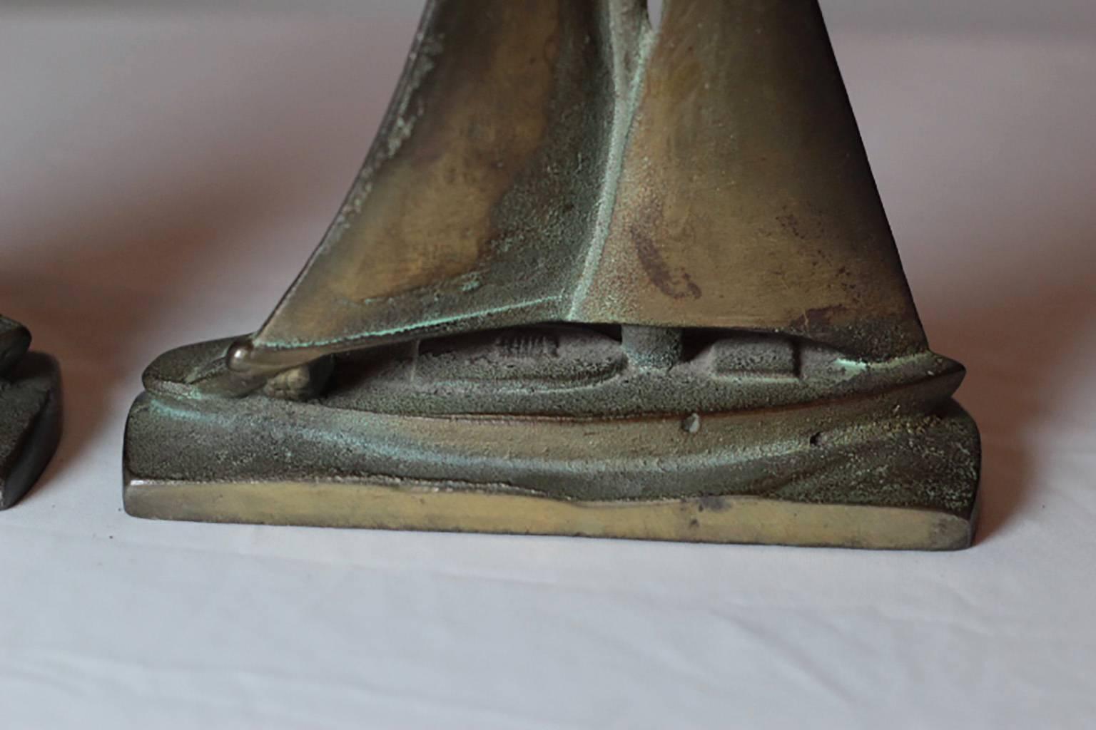 Patinated solid bronze sailboat bookends. 