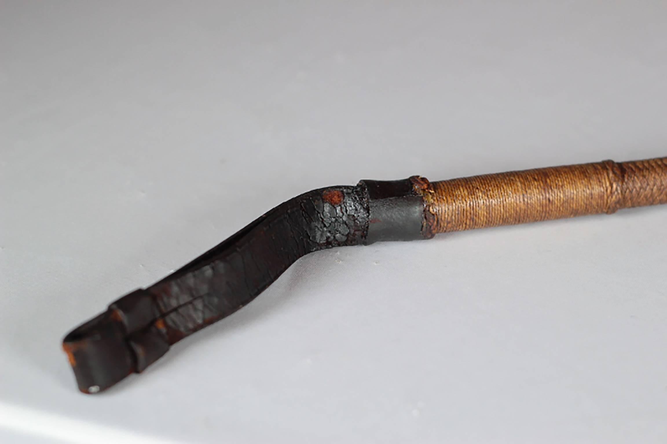English riding crop wrapped in rope leather and whip stitched leather, leather handle, silver plated bands and stag horn handle. 