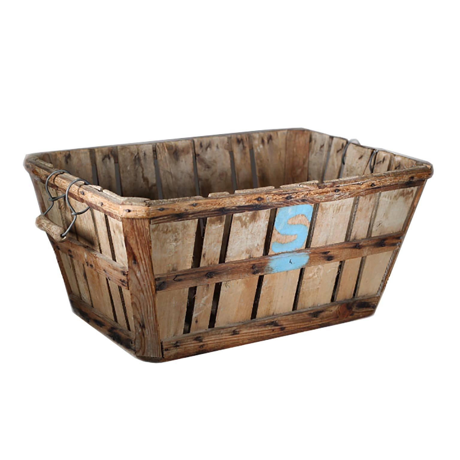 Antique apple orchard basket with metal and wooden handles, circa 1930s-1940s.
