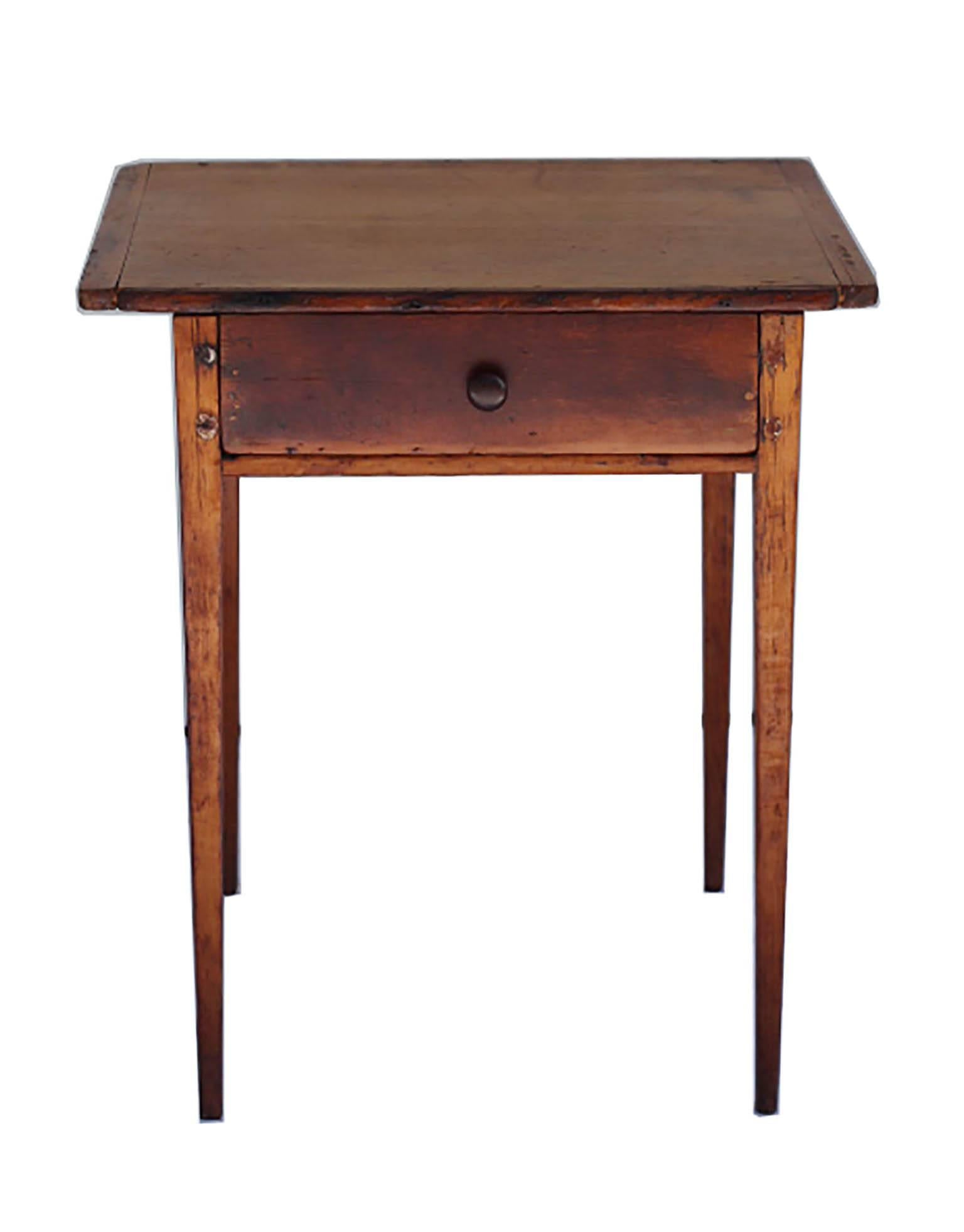 ABOUT

This is an extremely rare example of an 18th century cherry and Southern yellow pine side table c. 1770-1790. A one-drawer side table with a breadboard top and tapered legs. Likely made in the historic Harpers Ferry region of the south. This