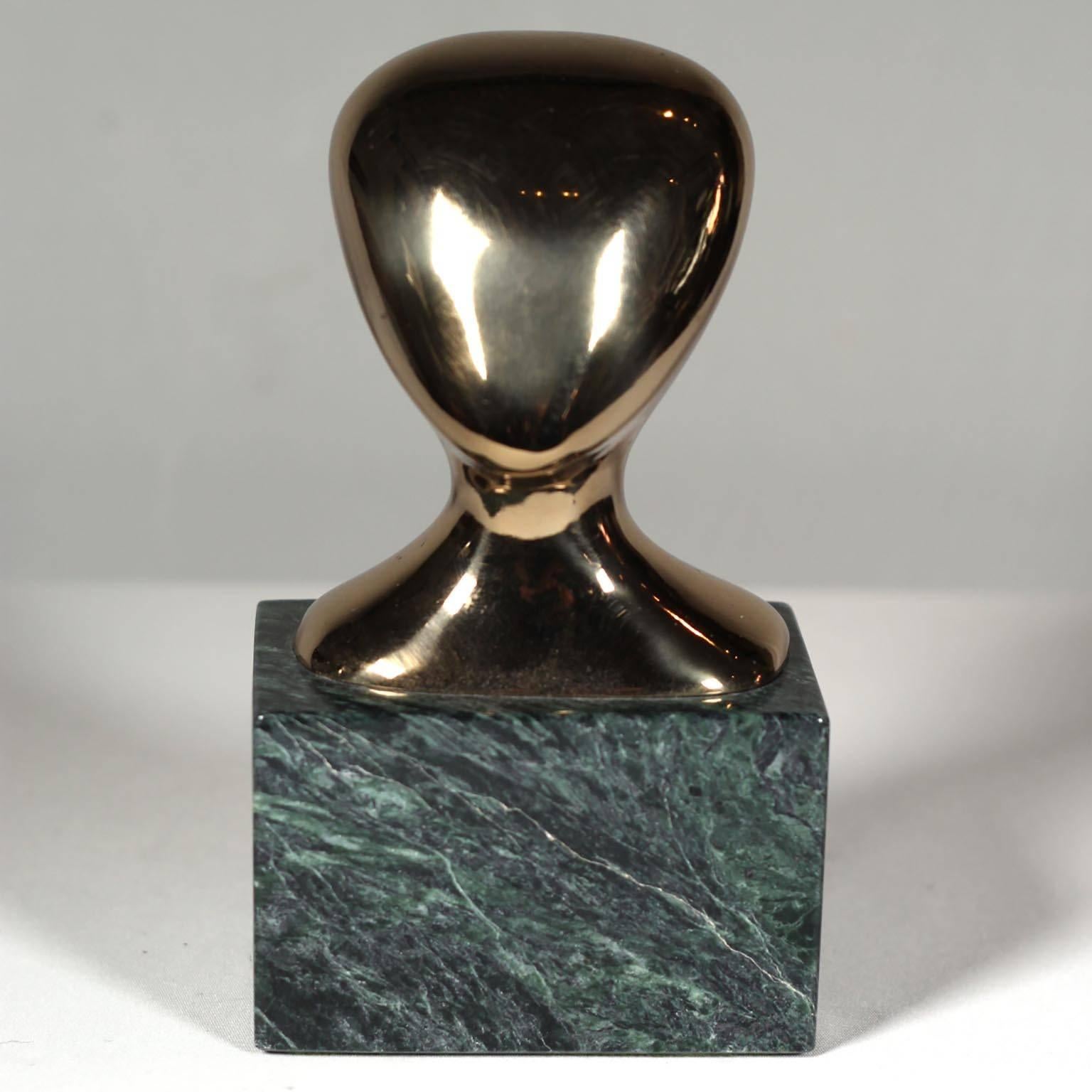 Patinated bronze figure on marble titled, "The Head" by artist Philip Argerson, circa 1970s.
