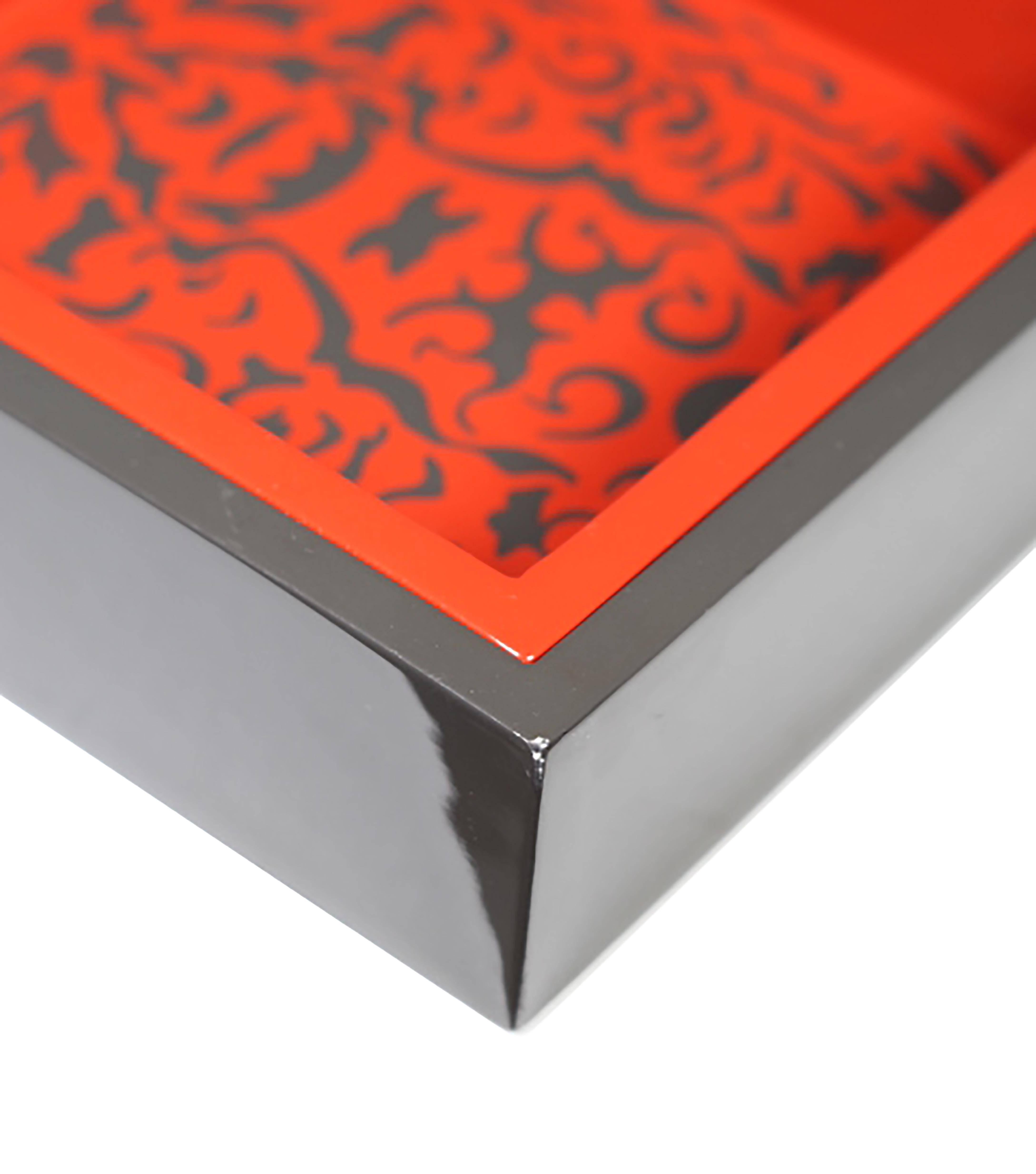 Red and grey lacquered nesting trays by Triton Lange with three removable smaller trays. Food safe.