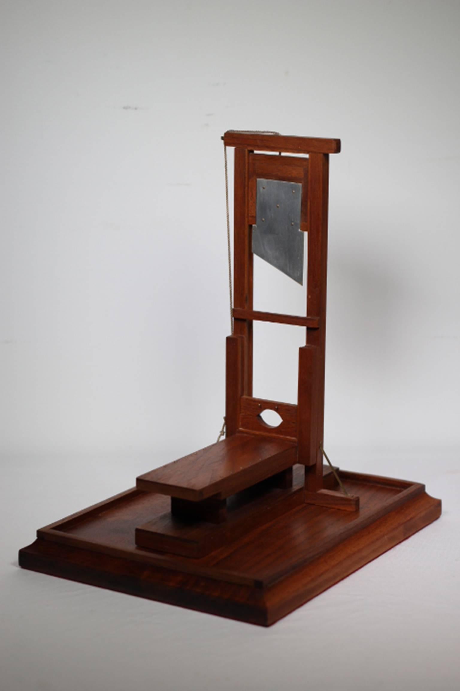 Fully functioning gallows and guillotine models handmade by a San Quentin prisoner in the 1980s. Signed and dated with the artist's prison number.

Two trap doors on the gallows are released by pulling the coresponding string and the "waiting