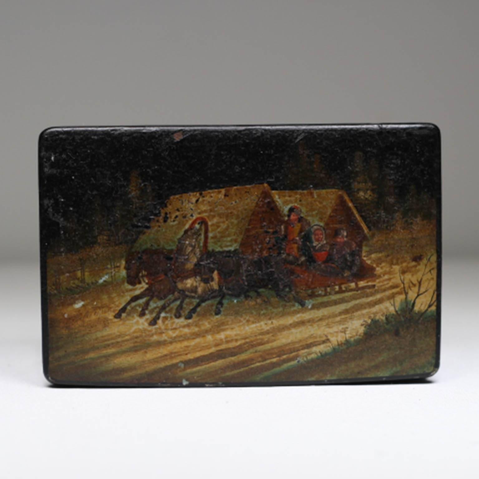 Hand-painted Russian tea or tobacco box with red lacquered interior.
