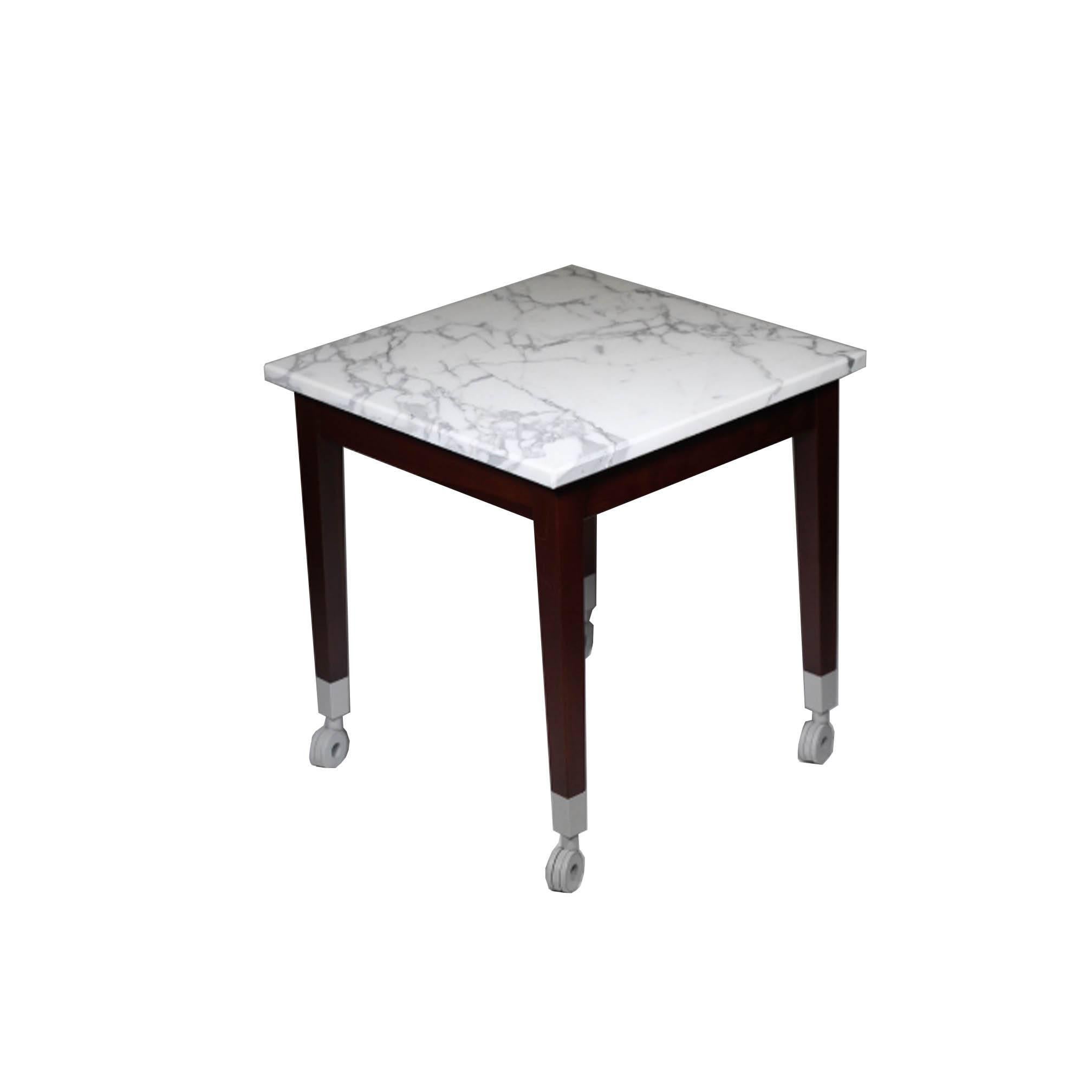 Designed: 1997.

Neoz small table.

Origin: Italy.

Marble topped small table with structure in solid mahogany wood. Leg teminals in aluminium casting and castors in nylon. 

Top in Calacatta Carrara marble.