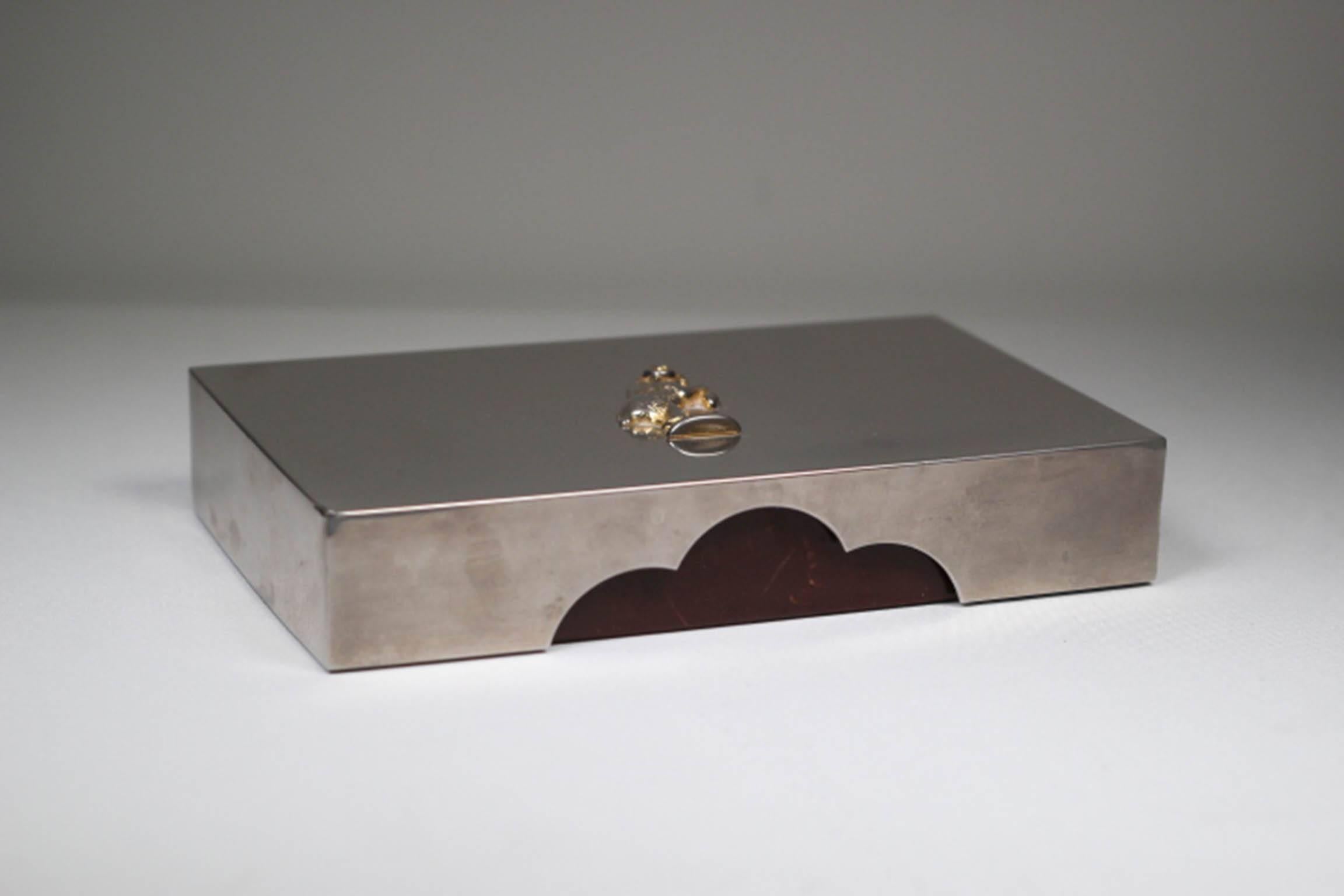 Leather trimmed wooden box with chrome top and ram embellishment. Made by San Francisco's Gump's Department store.