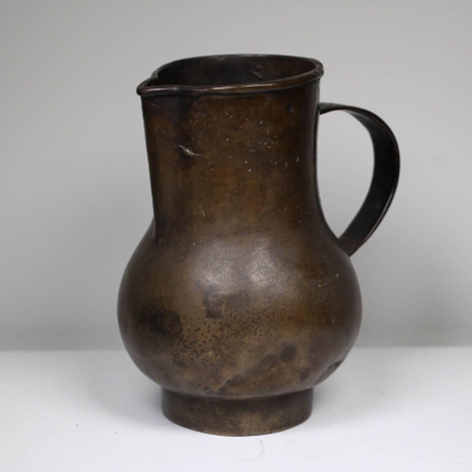 Early 20th century bronze pitcher. Excellent for flowers.