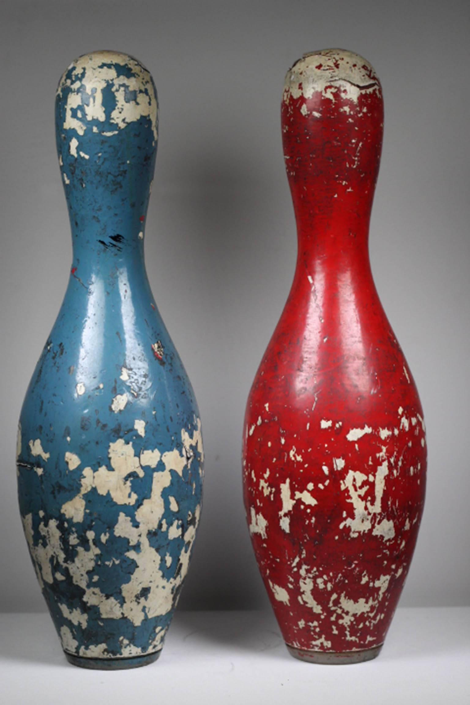 Beautifully distressed pair of vintage wooden bowling pins.