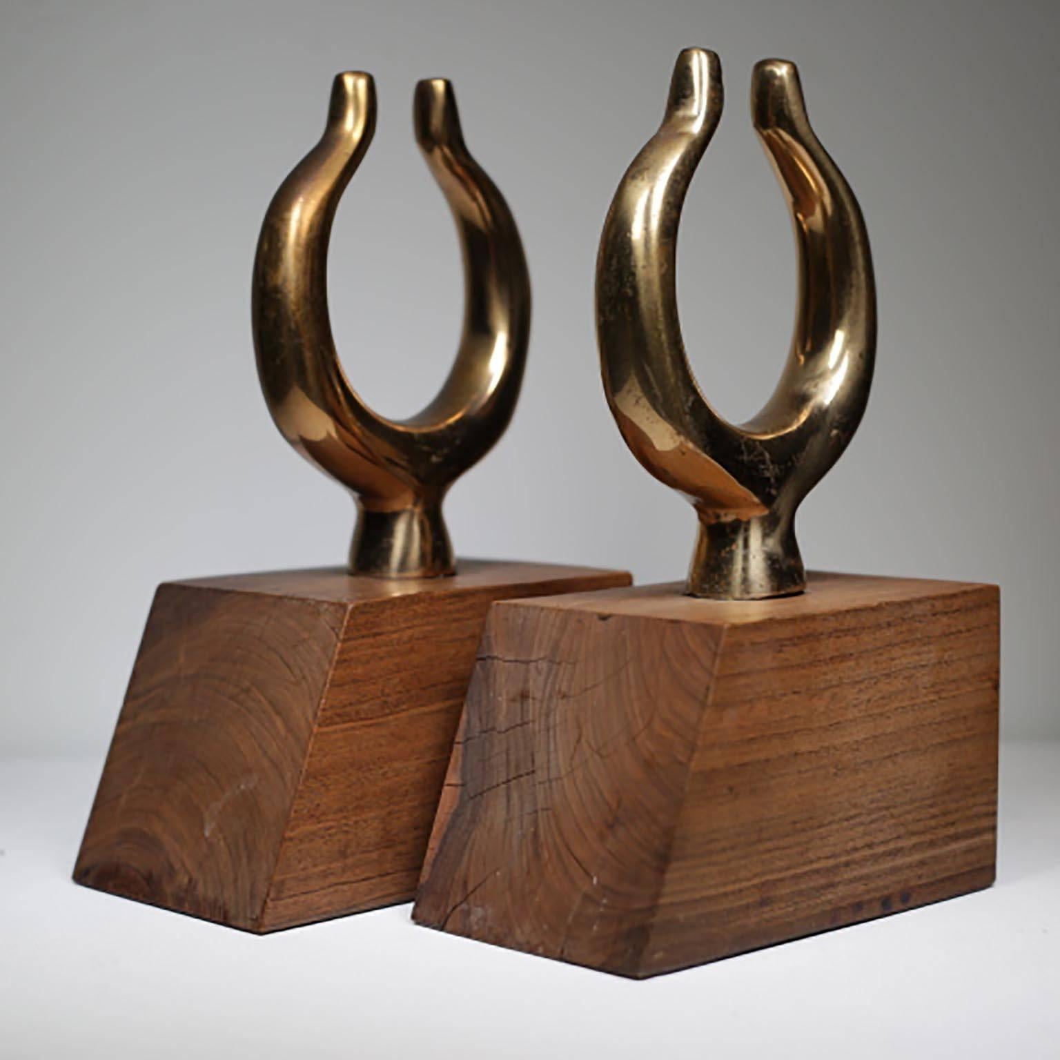 Pair of 19th century solid brass oar locks mounted on a mid-century wooden base, circa 1960s.