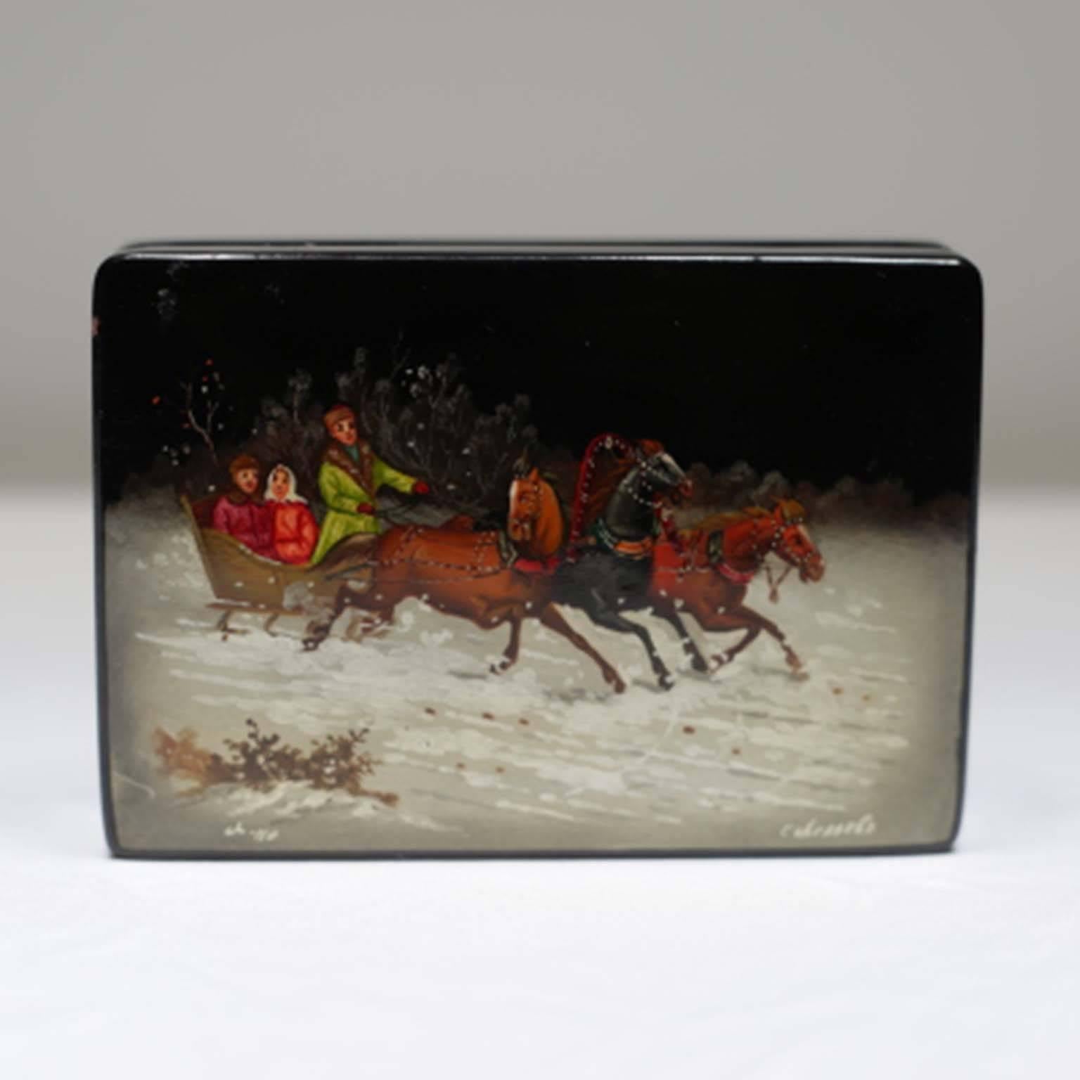 Lacquered box from the former Soviet Union with vibrant red interior. Signed by artist.