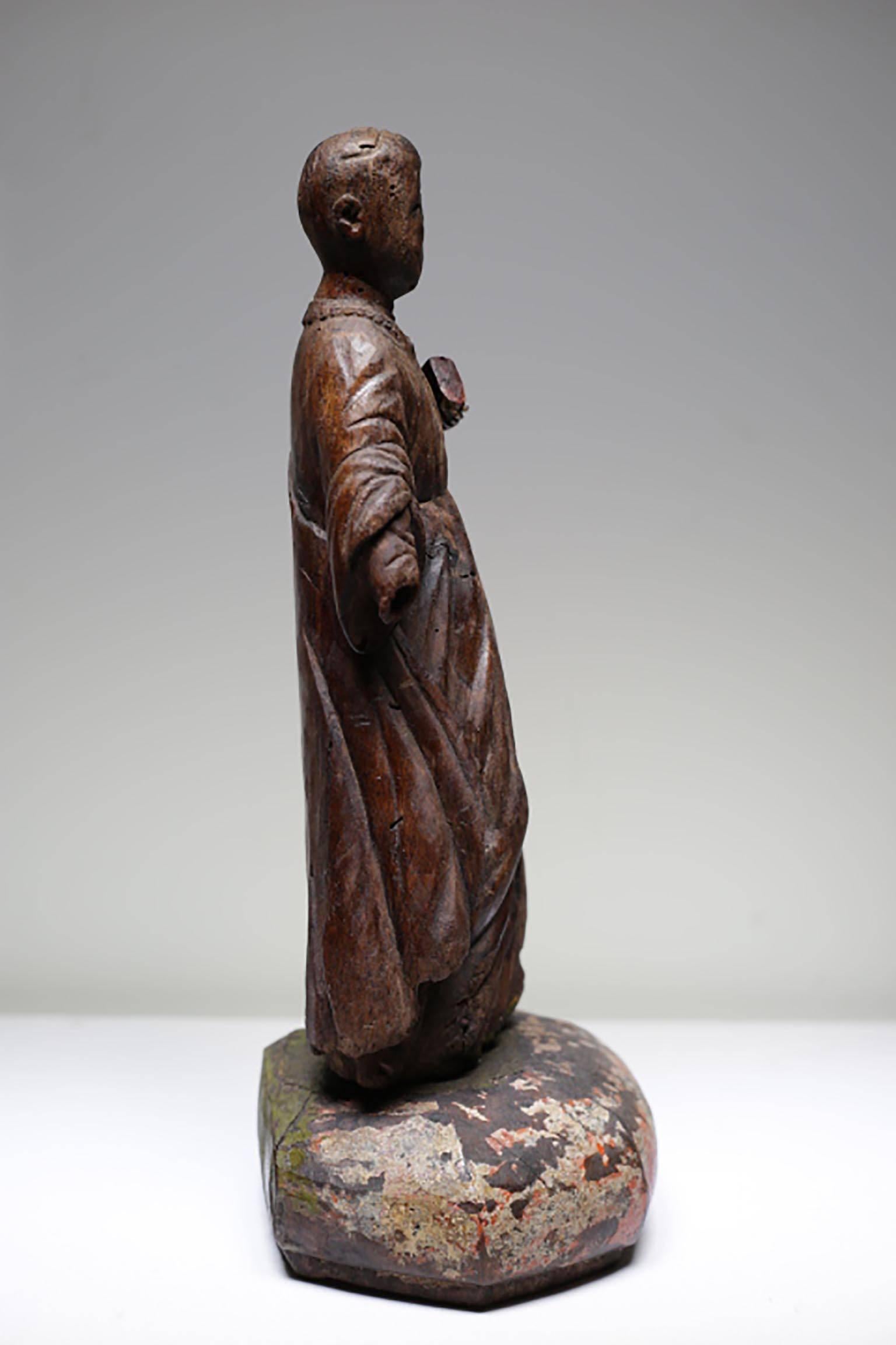 Asian carved wood figure of a Jesuit priest,
possibly Thai or Burmese, 17th-18th century.
