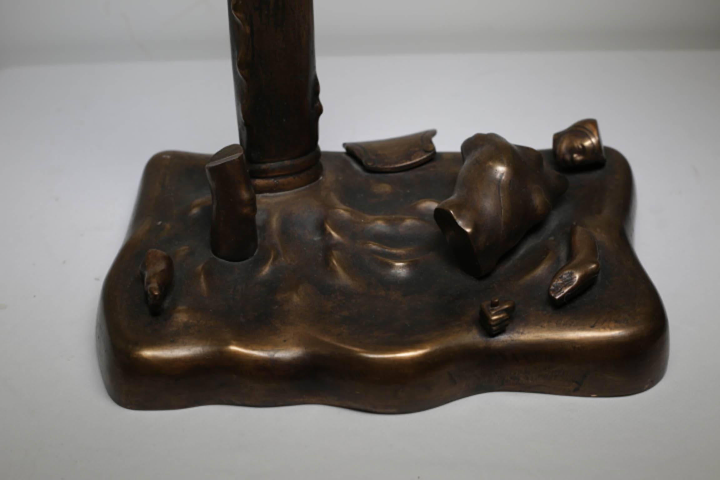 Solid bronze sculpture depicting body parts signed by M. Woodward. Woodward was a student of Henry Spencer Moore, an English artist. Moore is best known for his semi-abstract monumental bronze sculptures which this piece has been greatly influenced