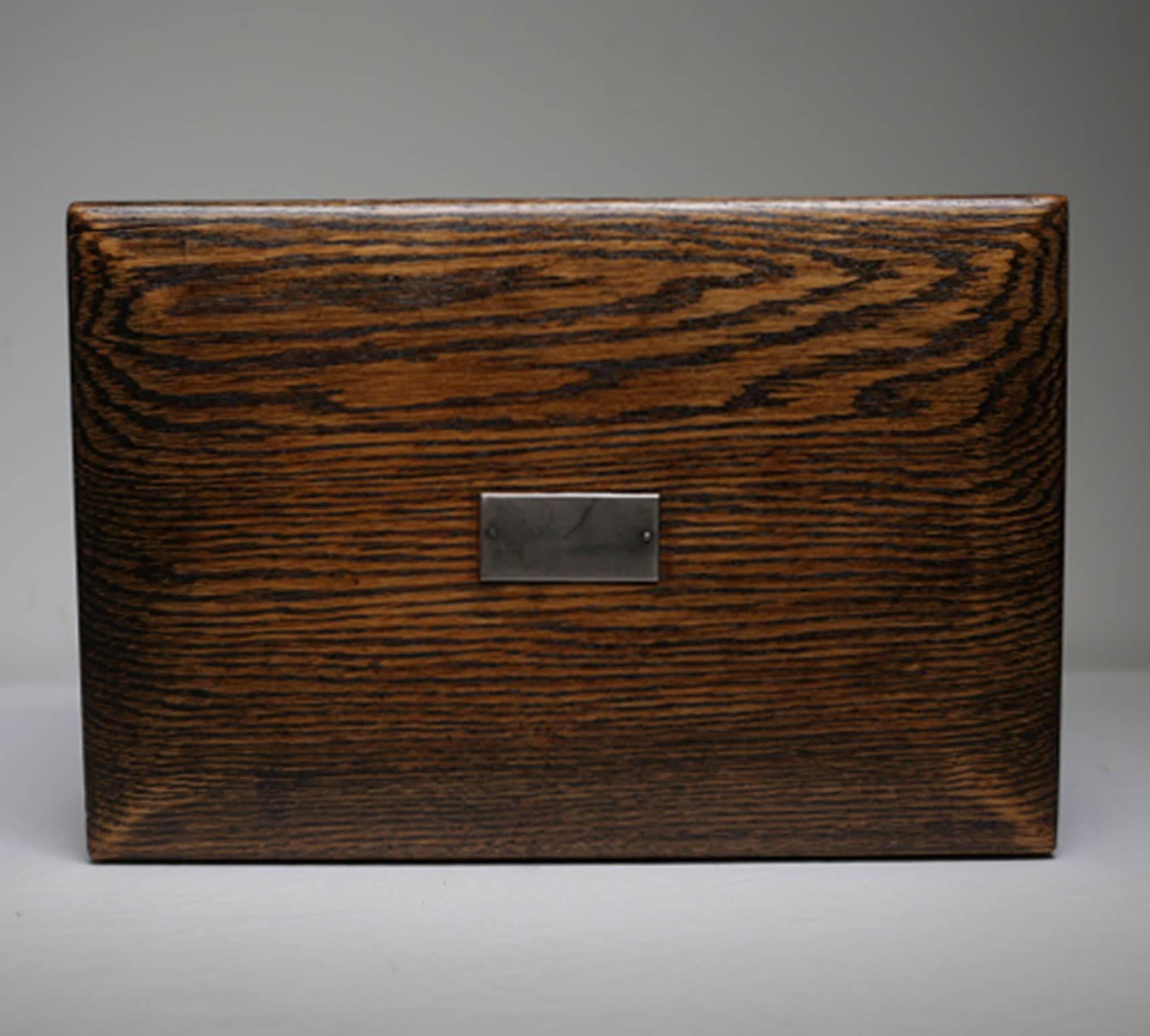 Vintage walnut humidor with metal nameplate, circa 1940s.
The interior is lined in tin.