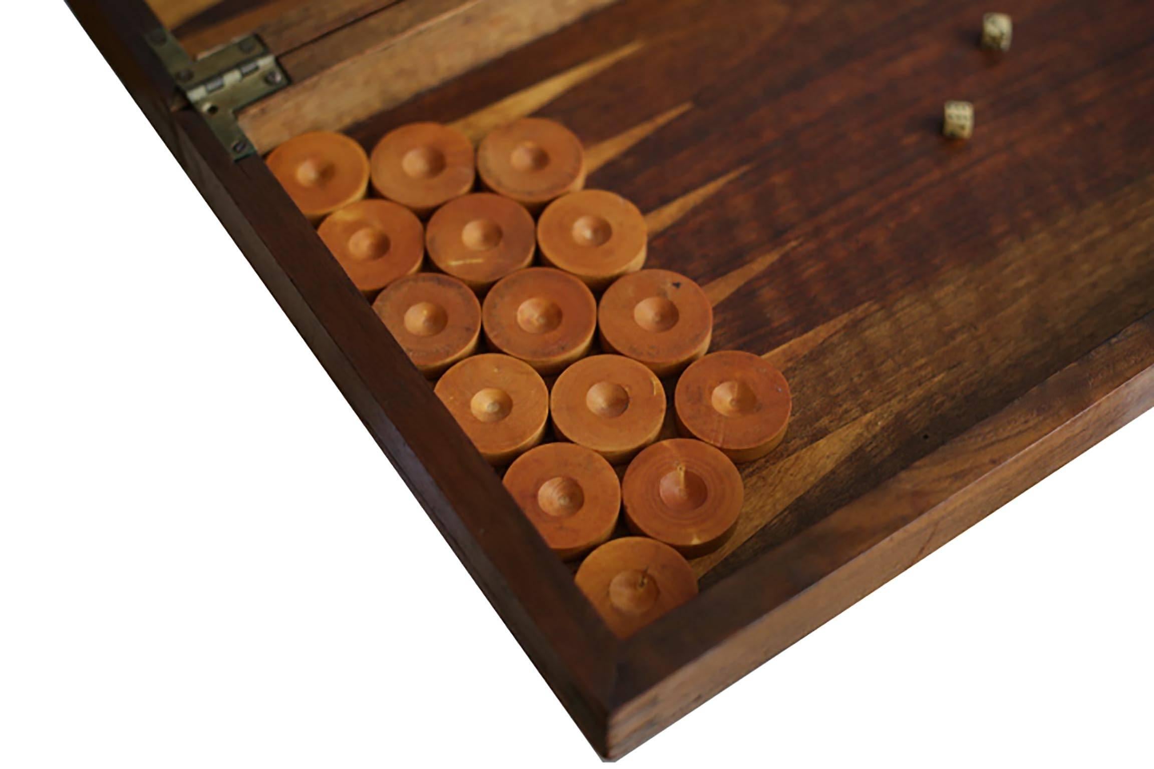 Lovely backgammon board with dovetail joints, wooden chips, and two bone dice. The chips are a complete set.