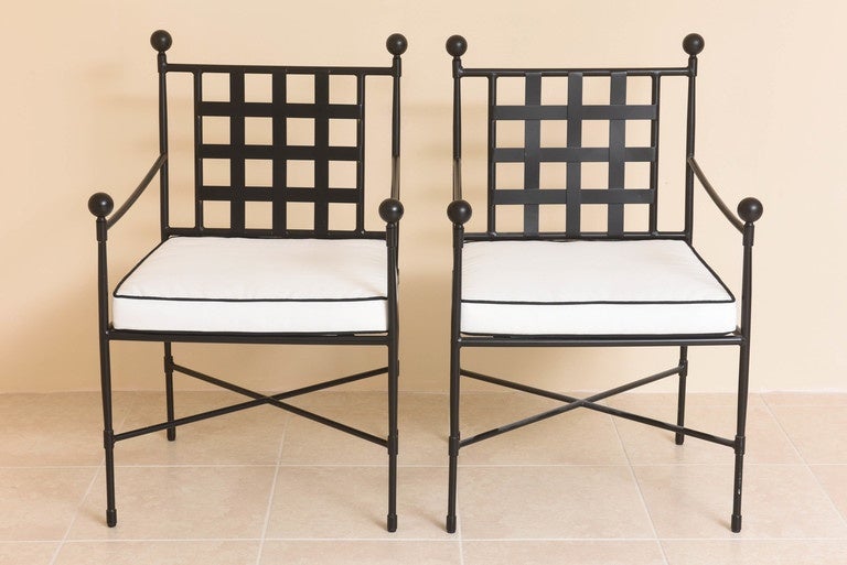
This complete set consists of two sofa/settees, two ottomans and four arm chairs.  The  frames of the pieces are painted black and the seat, back and throw cushions are in Sunbrella fabric.

The price of $4800.00 is for all eight
