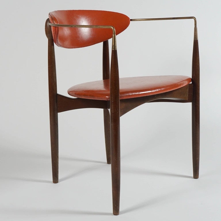 Dan Johnson Viscount chair. Walnut and brass frame with original orange vinyl upholstery.