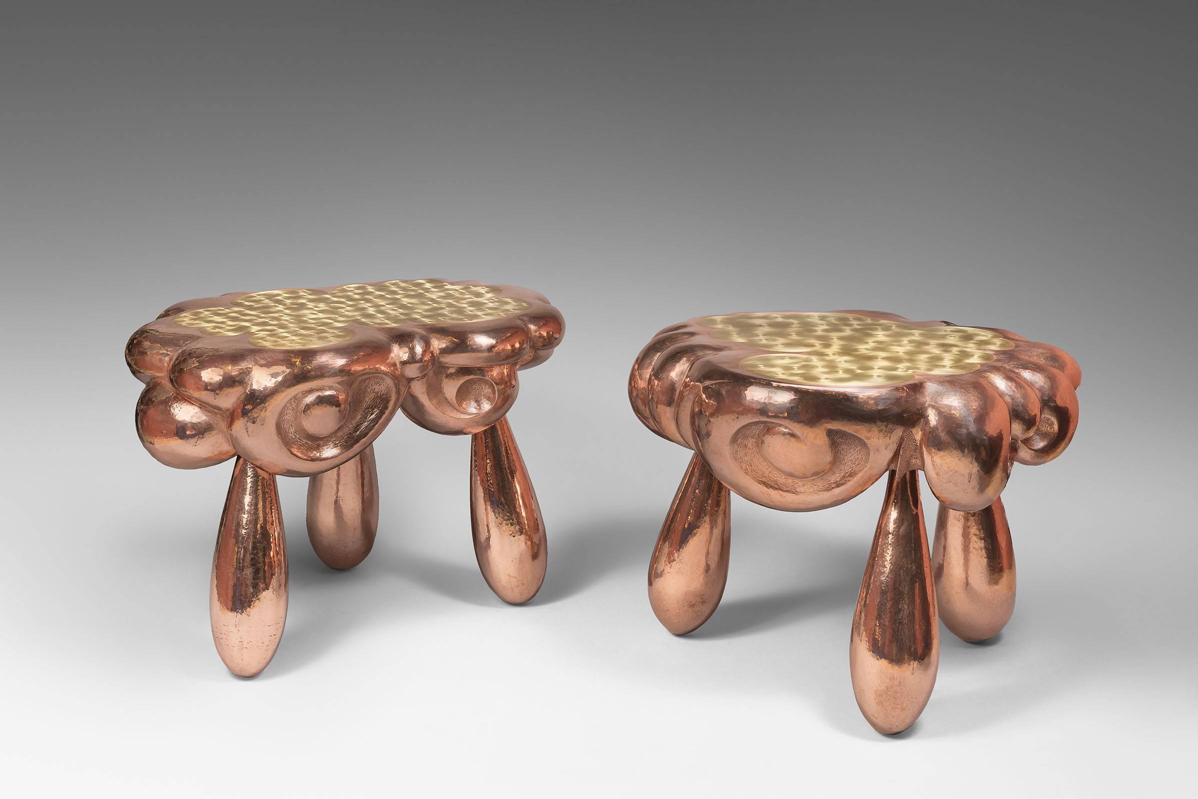Nathanaël Le Berre.
Born in 1976.
Nathanaël Le Berre Laureat 2014 of Liliane Bettencourt award for the cleverness of the hand. 
Pair of coffee tables 2016 "Clouds on three drops of rain," hammered and engraved copper, tops adorned with