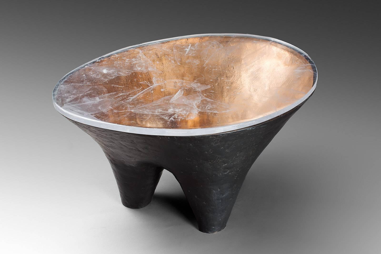 Franck Evennou 2013, Unique tripode Dolmen coffee table, Bronze, brown and gold patina, entrelacs of bronze, molten glass 80 X 60 X 46 cm, unique pieces,
Dated and Signed 
This unique bronze Dolmen table is presented with its molten glass top .or