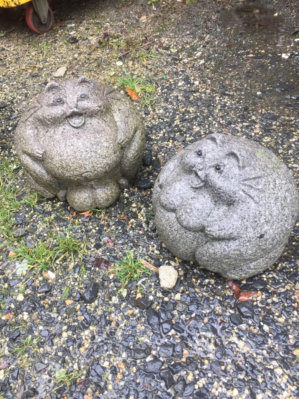 Japan, this charming and unusual pair of male and female round hand carved granite stone folk art tanuki (a Folk Art hero raccoon dog/ Tanuki) await placement in your favourite garden place or indoor space!

Tanuki is a noted sake loving party