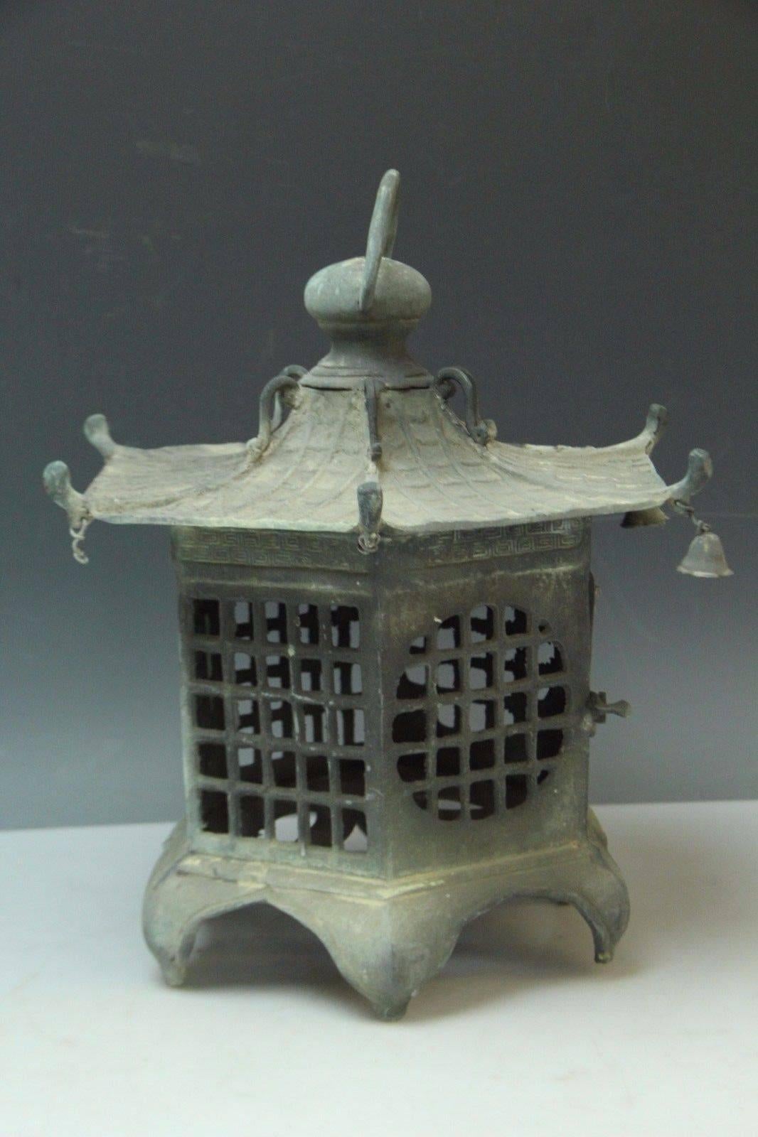 Here's a beautiful and unique way to accent your indoor or outdoor garden space with this wonderful old treasure from Japan!

This is a bronze casting of a wonderful pagoda form lantern dating to the Taisho period, 1912-1926

It is fully