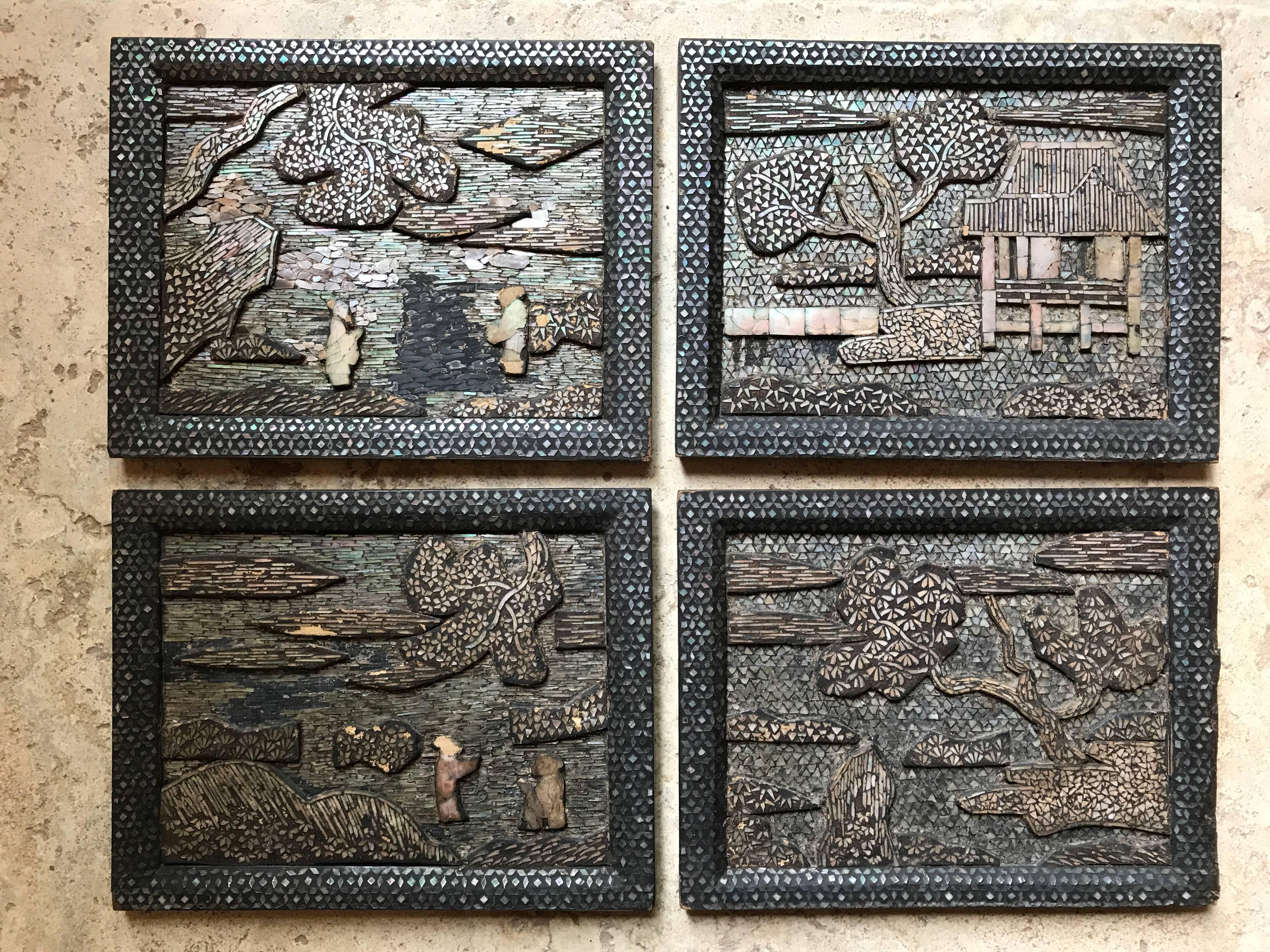 Here's a fine instant collection of four Japan antique mother-of-pearl inlaid wooden panels in the Chinese manner including trees, buildings, and colorful village scenes. These panels would make a wonderful quartet framed and displayed on your