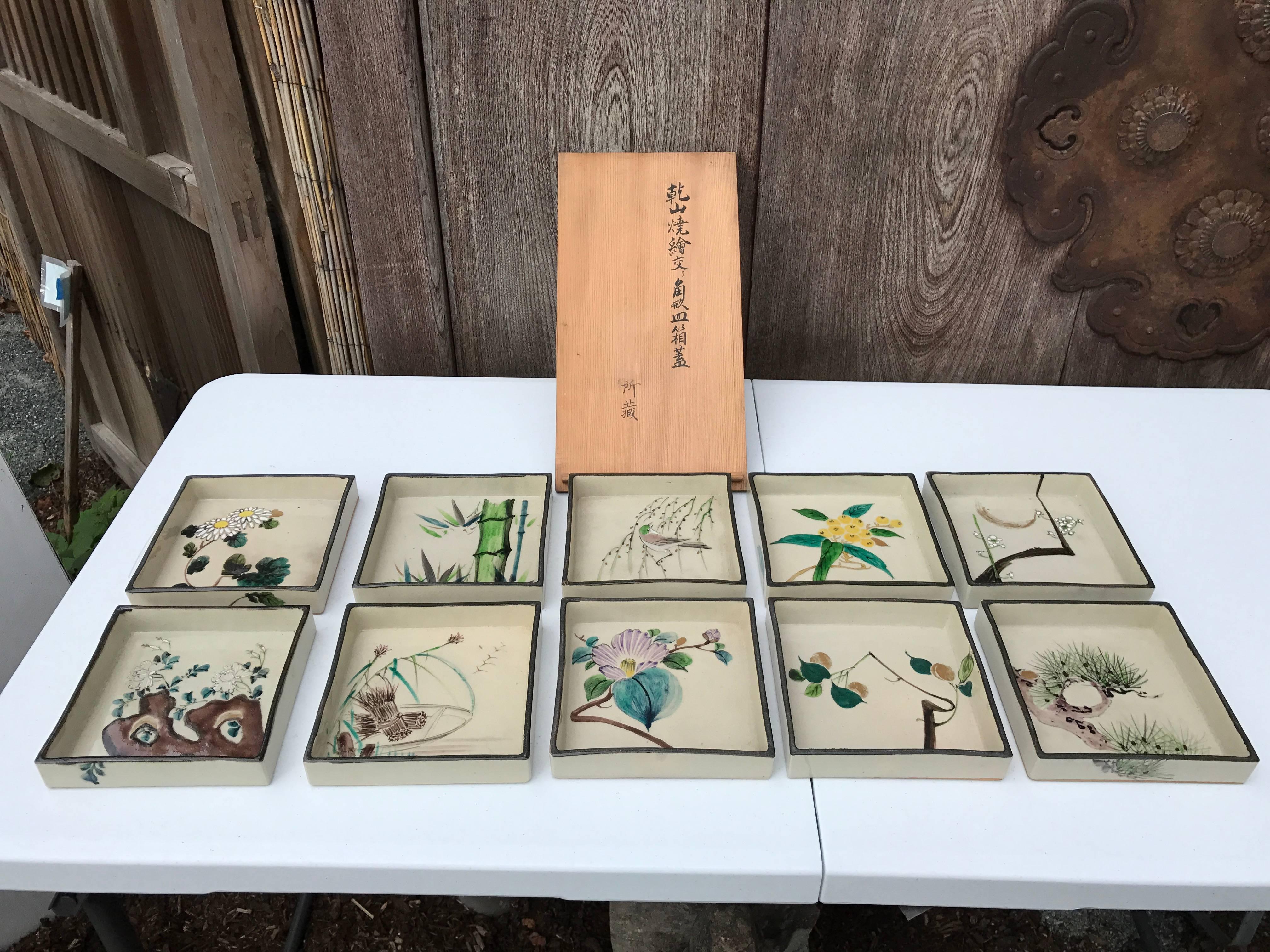 Mint, signed and boxed

A wonderful Japanese antique collection of ten (10) attractive hand-painted ceramic botanical and bird square shaped low bowls Kakuzara or ceramic plates dating to the Mid-20th century, Taisho period, probably an Arita kiln.