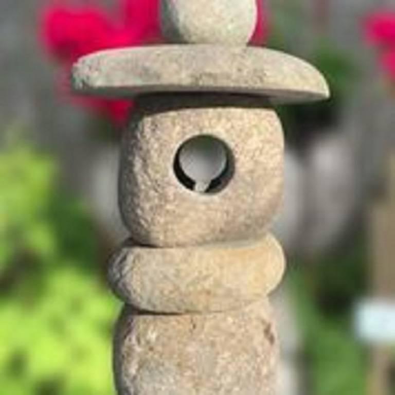 Here's a very nice sized stone -Spirit- lantern carved from natural boulders and ideally suited for a small to medium garden out of doors or inside in your favourite sun space. 

The striking and well proportioned stone lantern is fashioned in five