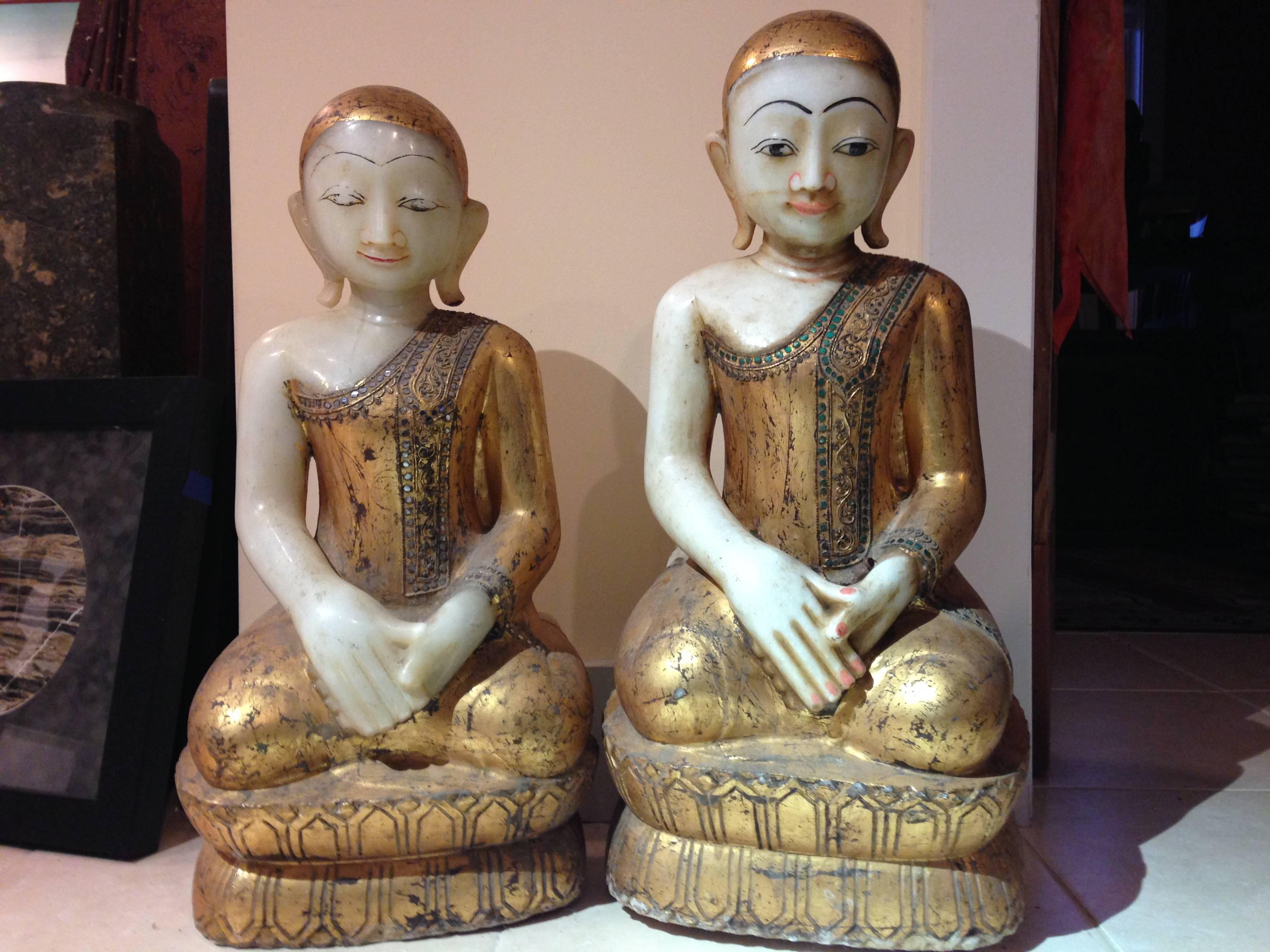 Burma, Mandalay, a pair of antique hand carved, hand lacquered , and gilt stone garden attendants in joyful pose

Superb condition

Dimensions:  Tallest is 26 inches high and 12 inches width

The joyful attendants in a worshipful pose with hands