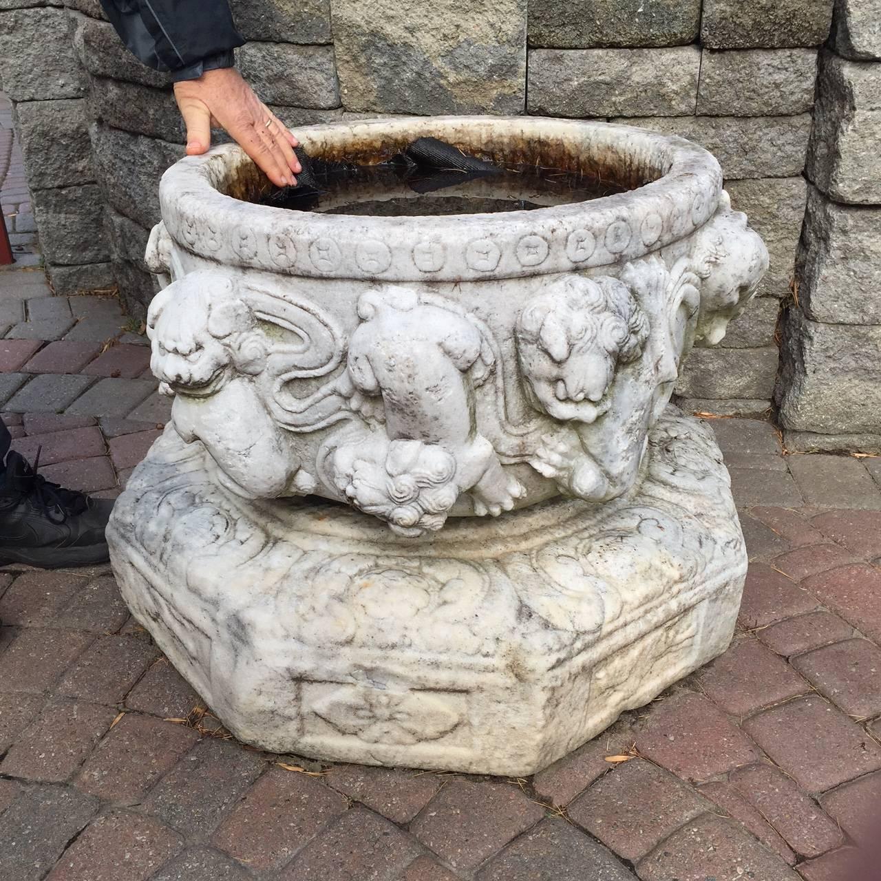 You cant help admiring this imposing China hand-carved marble foo dog planter or water bowl with its separate highly carved base - each a wonderful work of art making a fine and wonderful antique two-piece ensemble.

Dimensions:  They together